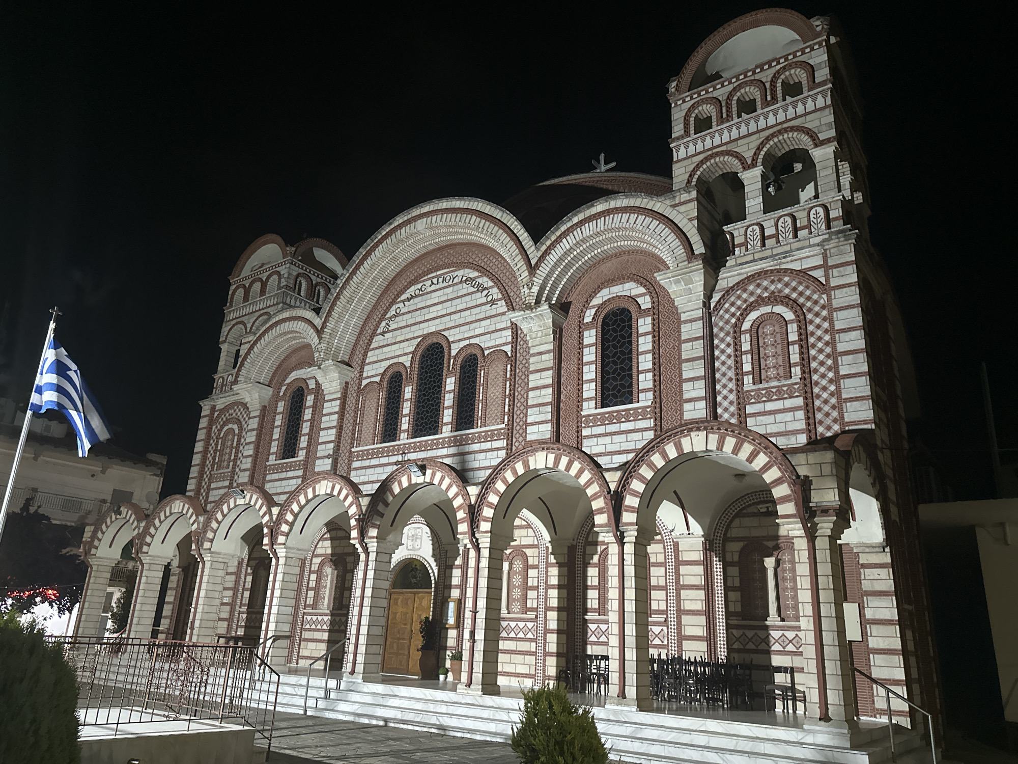 Ornate Orthodox church illuminated at night in Asprovalta, Greece