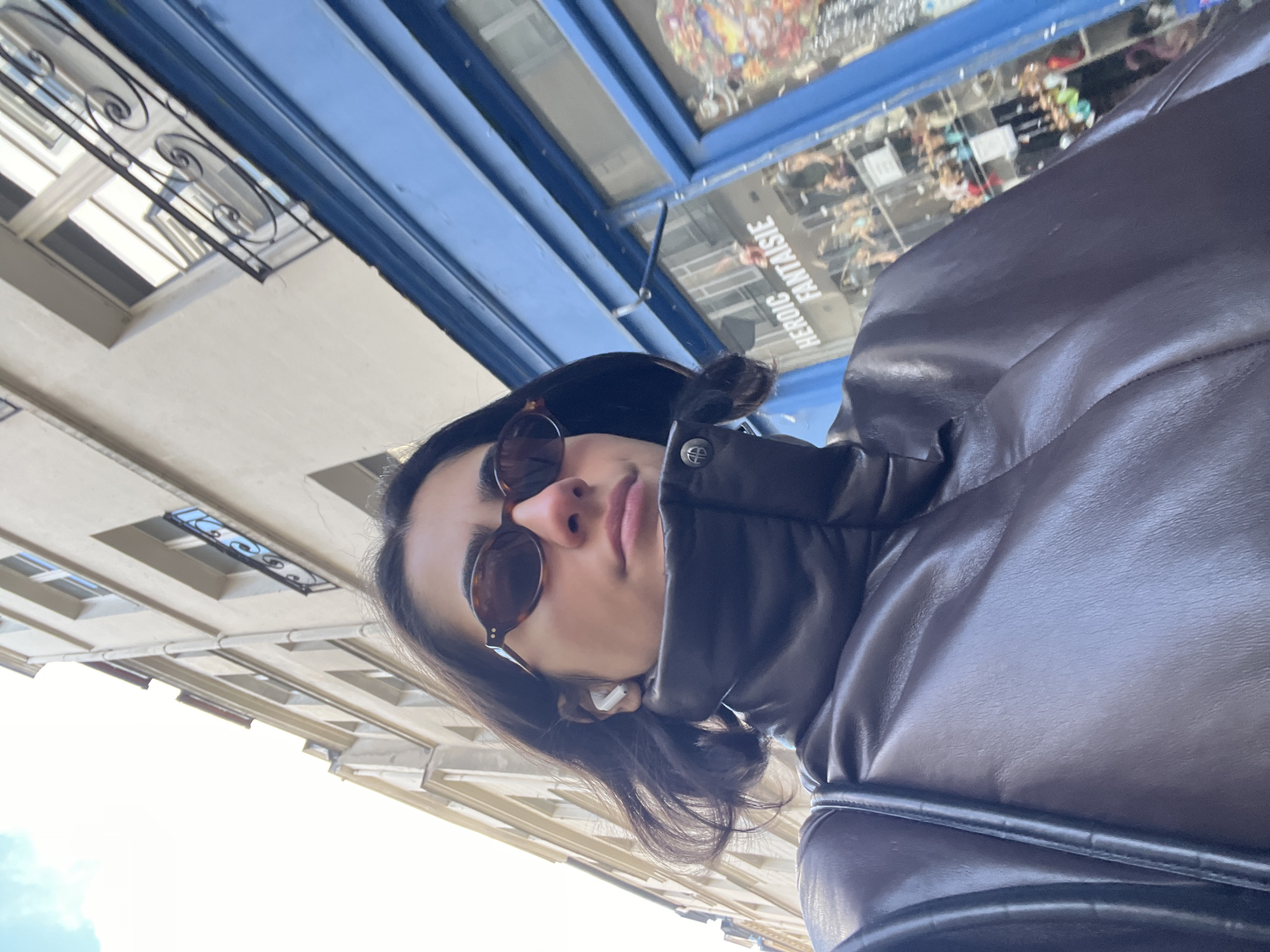 Tourist takes selfies on Paris street