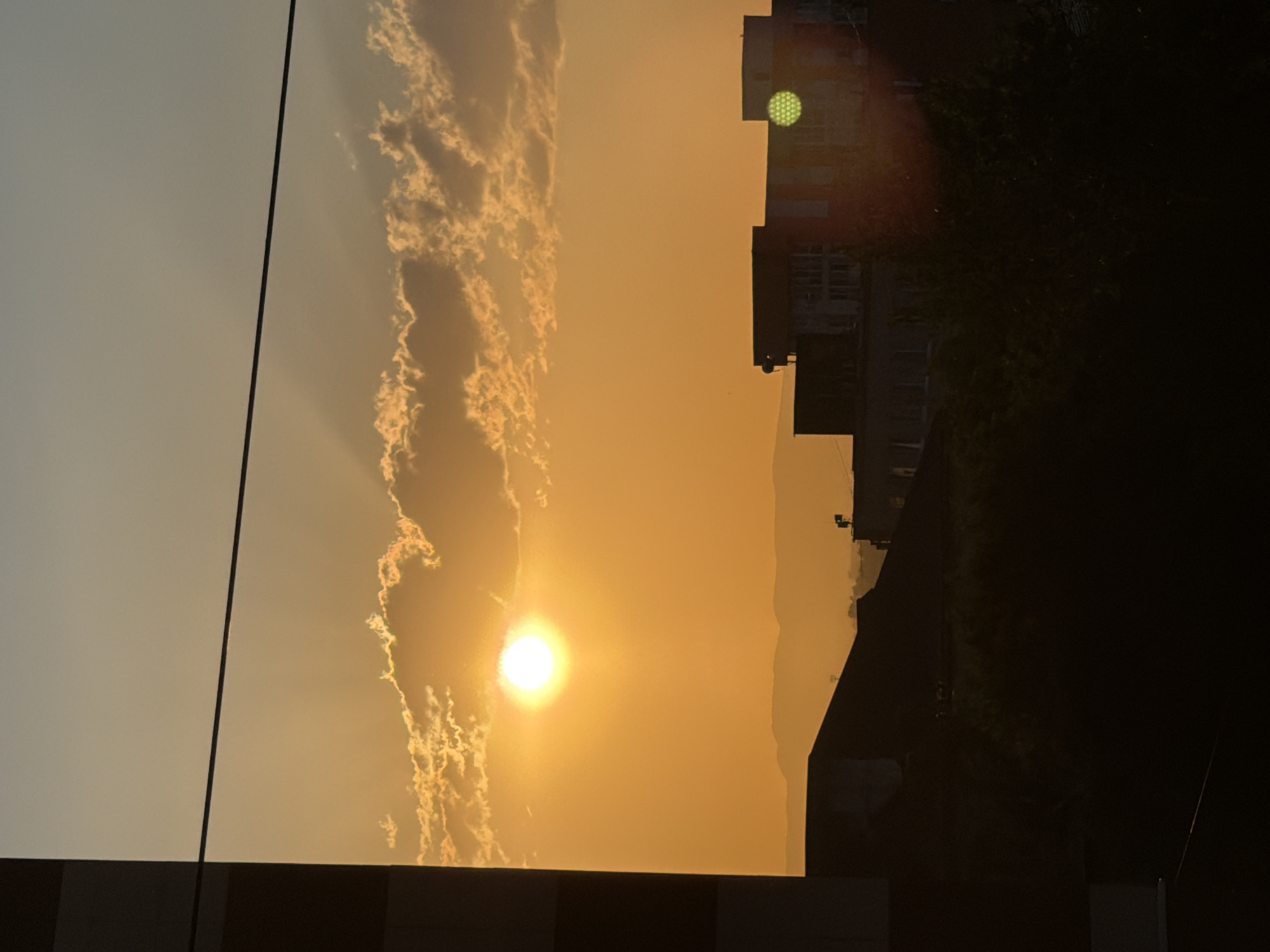 Hazy sunset observed through smoky skies in Artyom, Russia