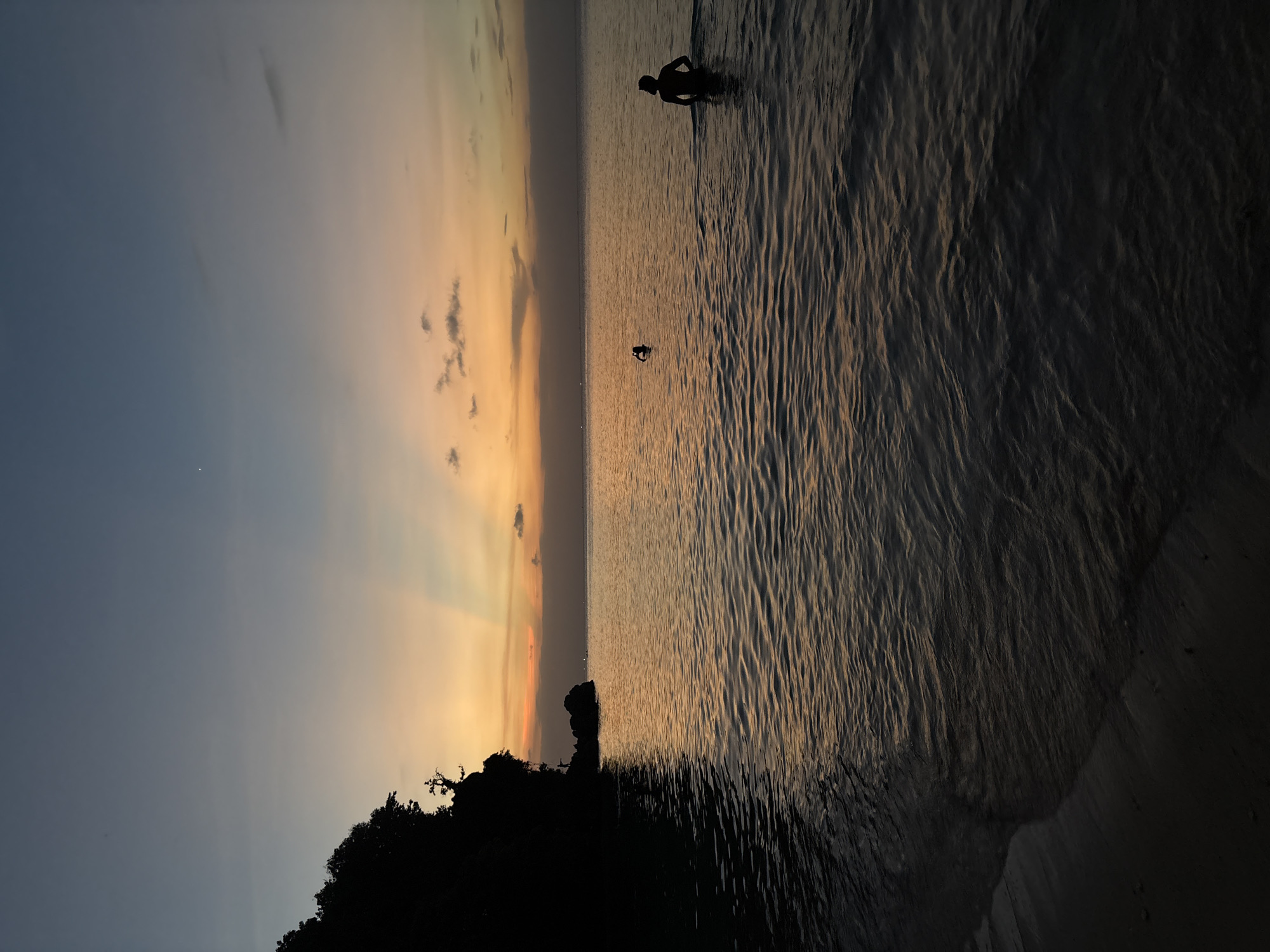 Sunset with crepuscular rays observed at Kuta Selatan beach