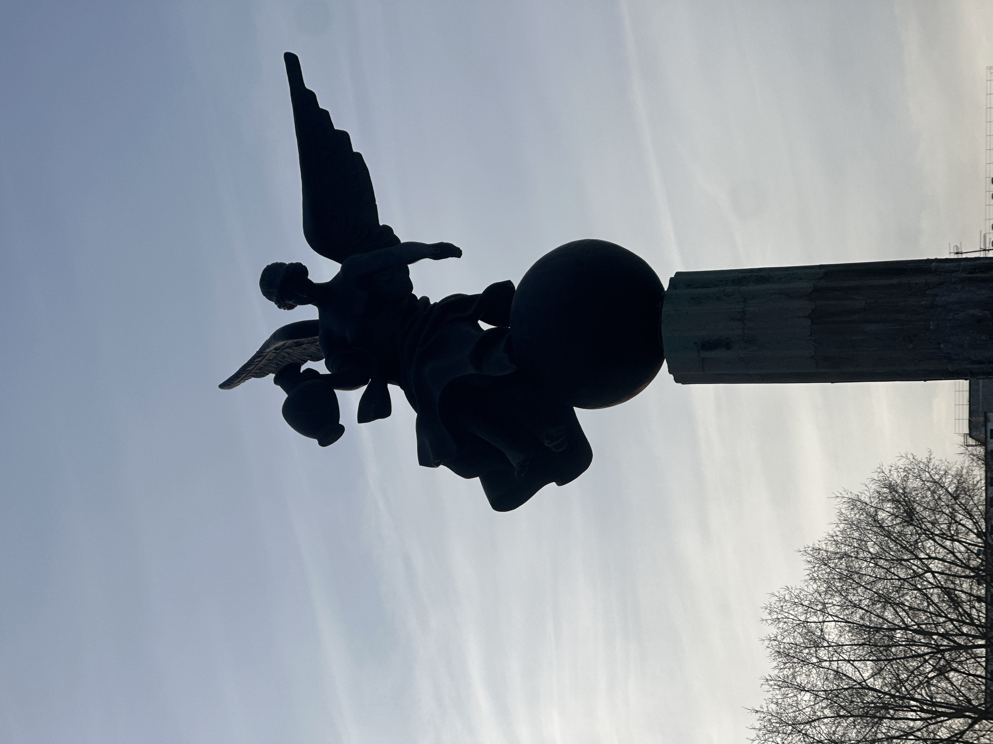 Woman visits angel monument in Surgut city square