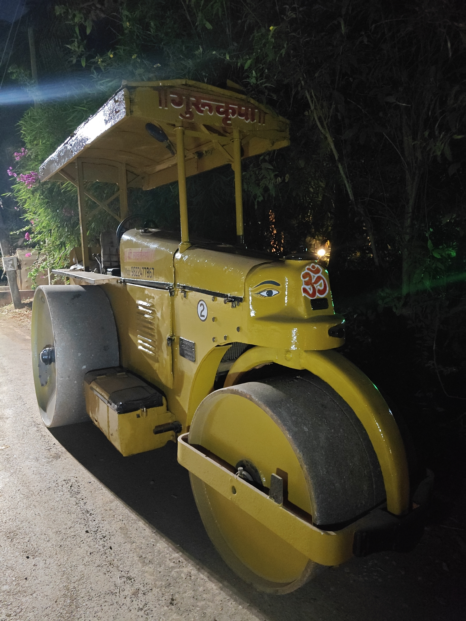 Decorated road roller parked in Korgao, India