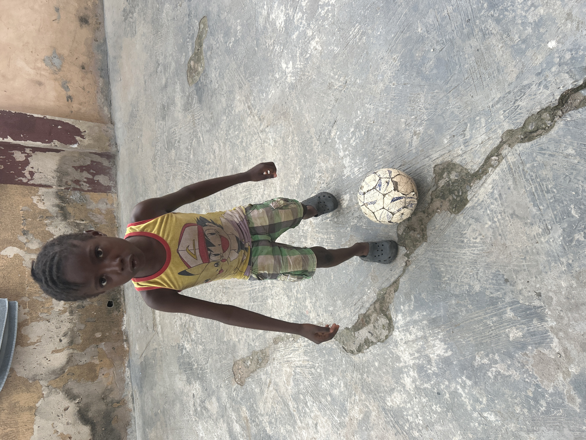 Children play and clean in Lagos courtyard