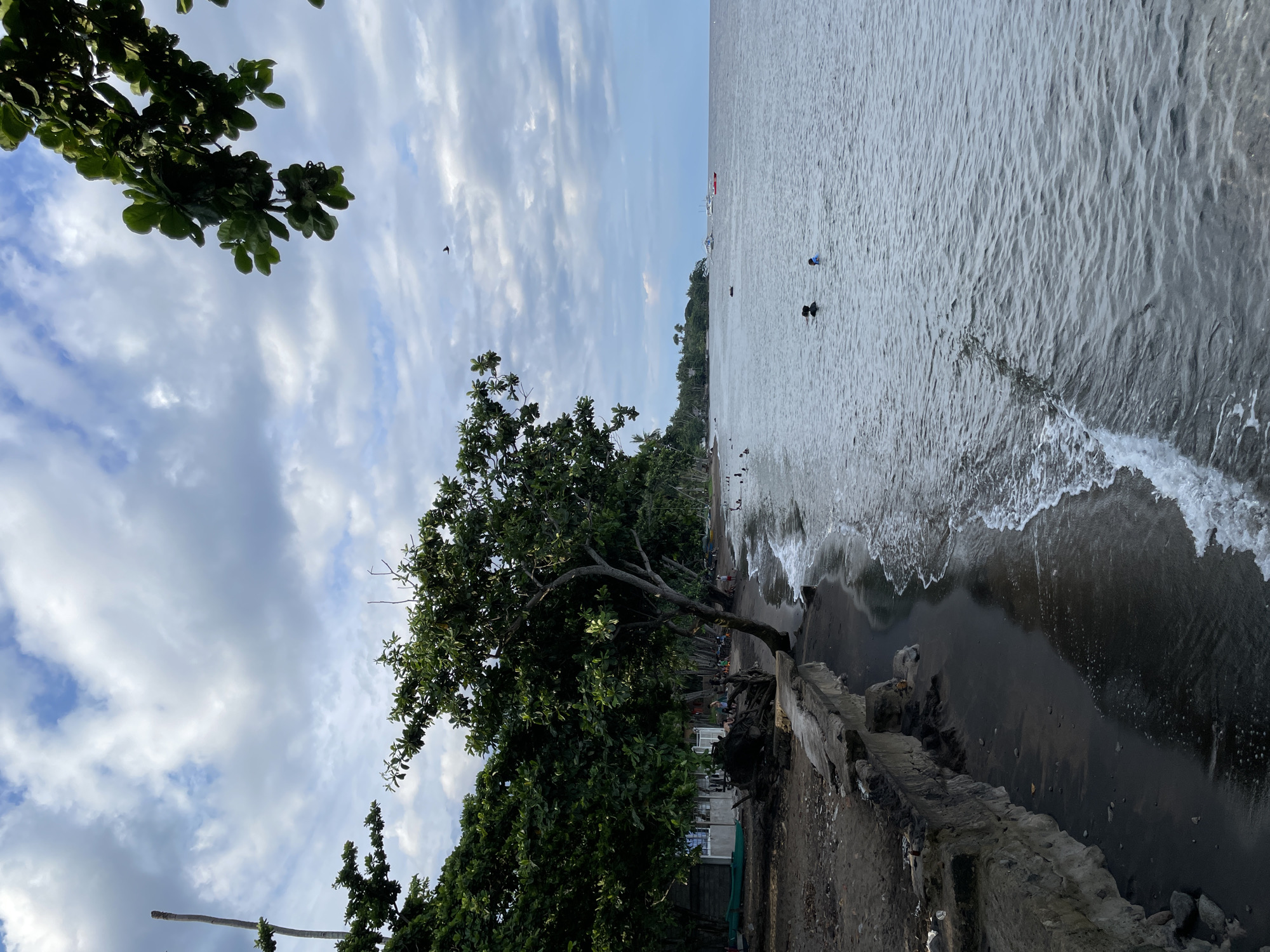 Quiet morning on Dauin's dark sand beach