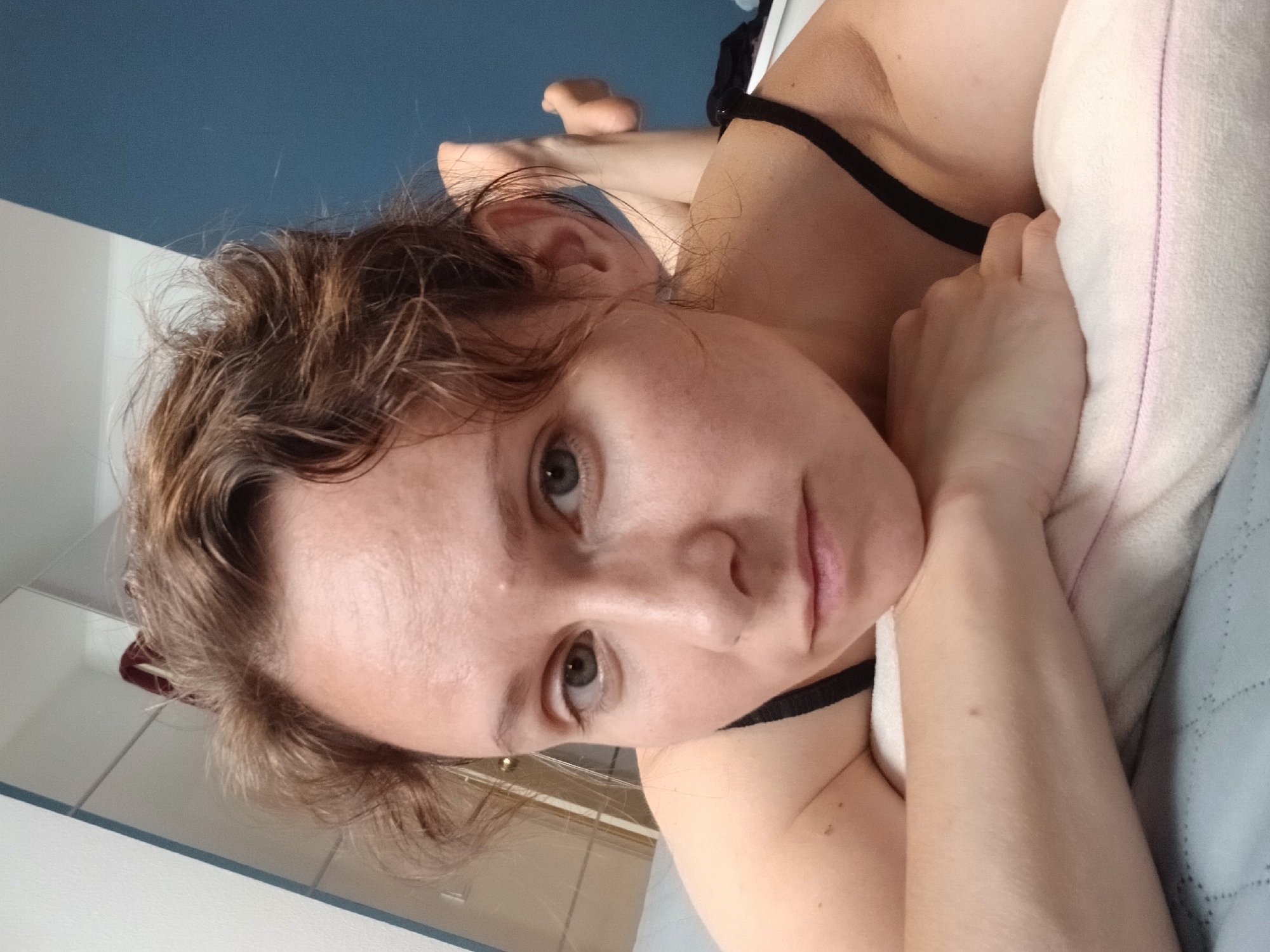 Casual close-up selfie on a bed in Yekaterinburg