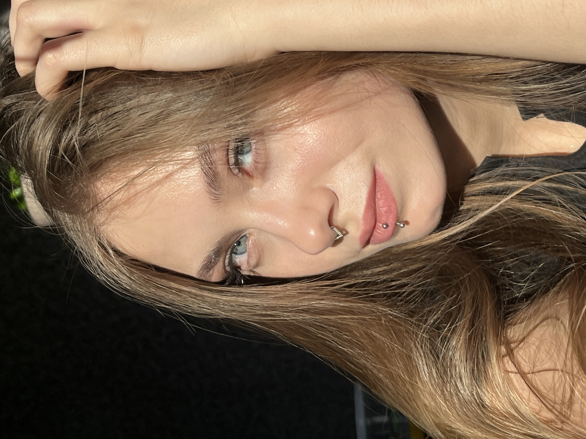 Young woman with piercings photographed in Russian village