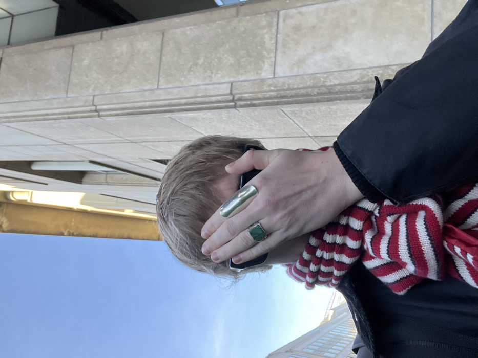 Person photographed with hand covering face in Brussels