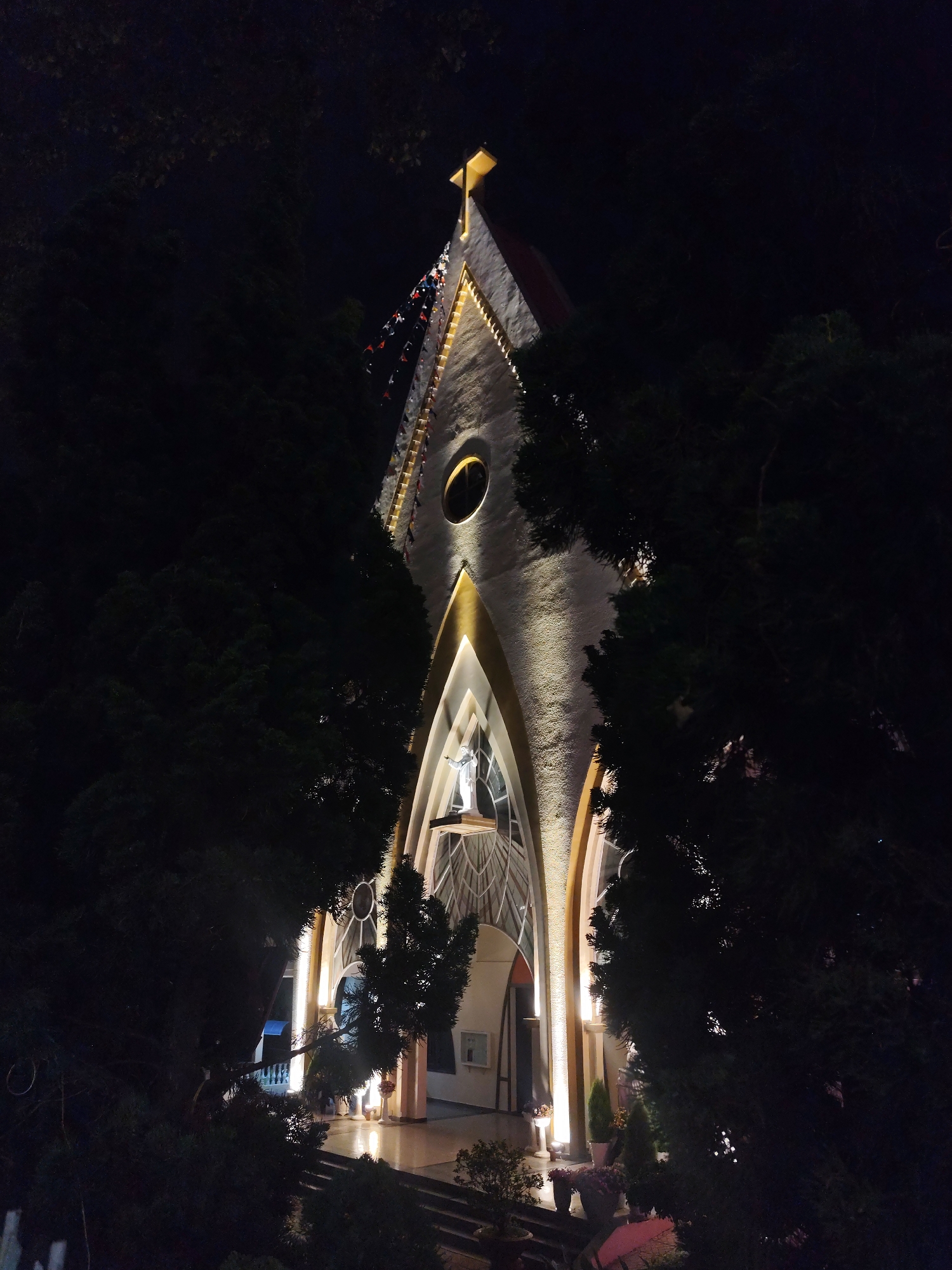 Nighttime illumination captured at Da Lat church and restaurant