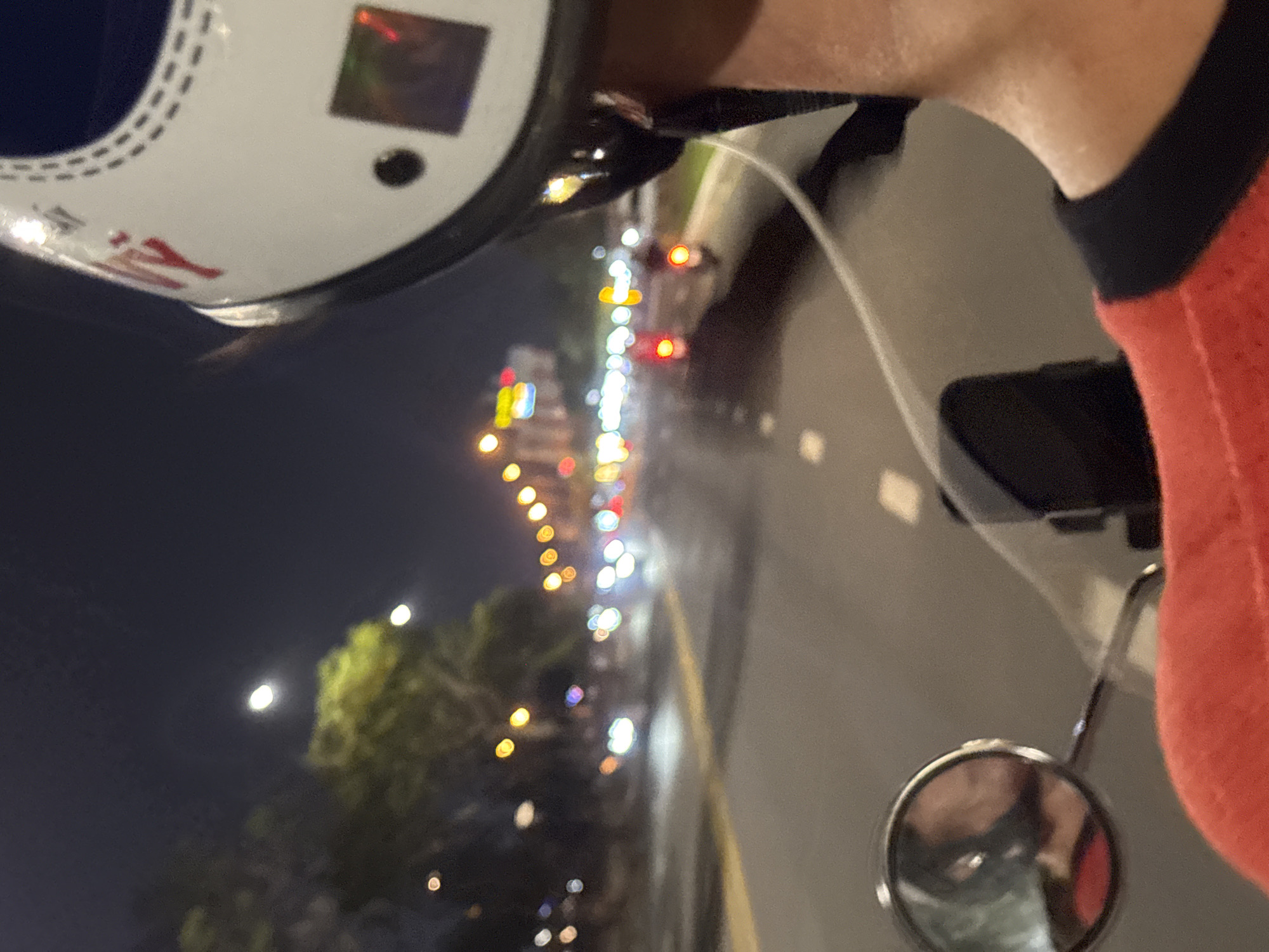 Nighttime motorcycle ride through Đà Nẵng streets captured