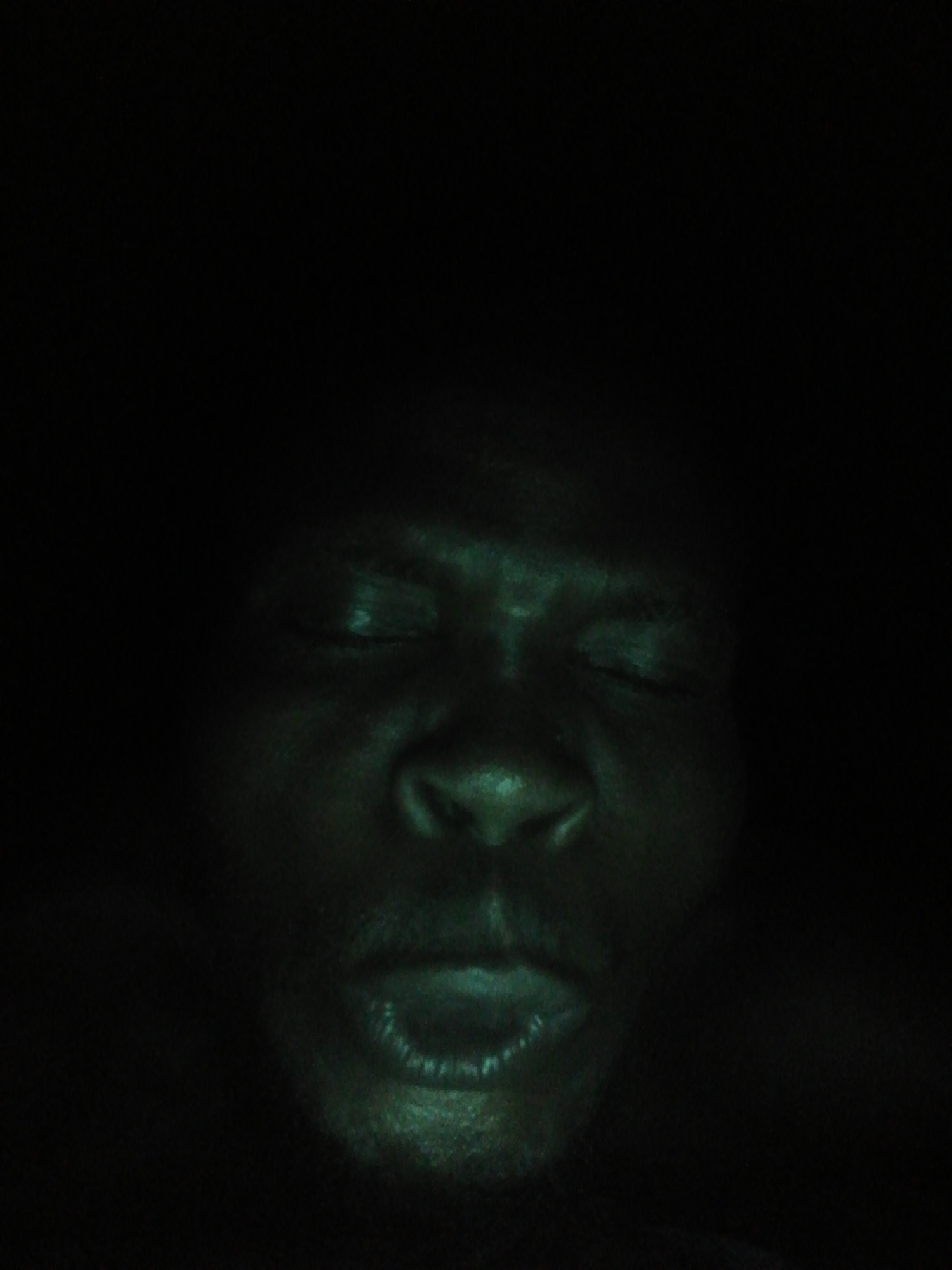 Multiple photos document man's varying expressions over evening hours