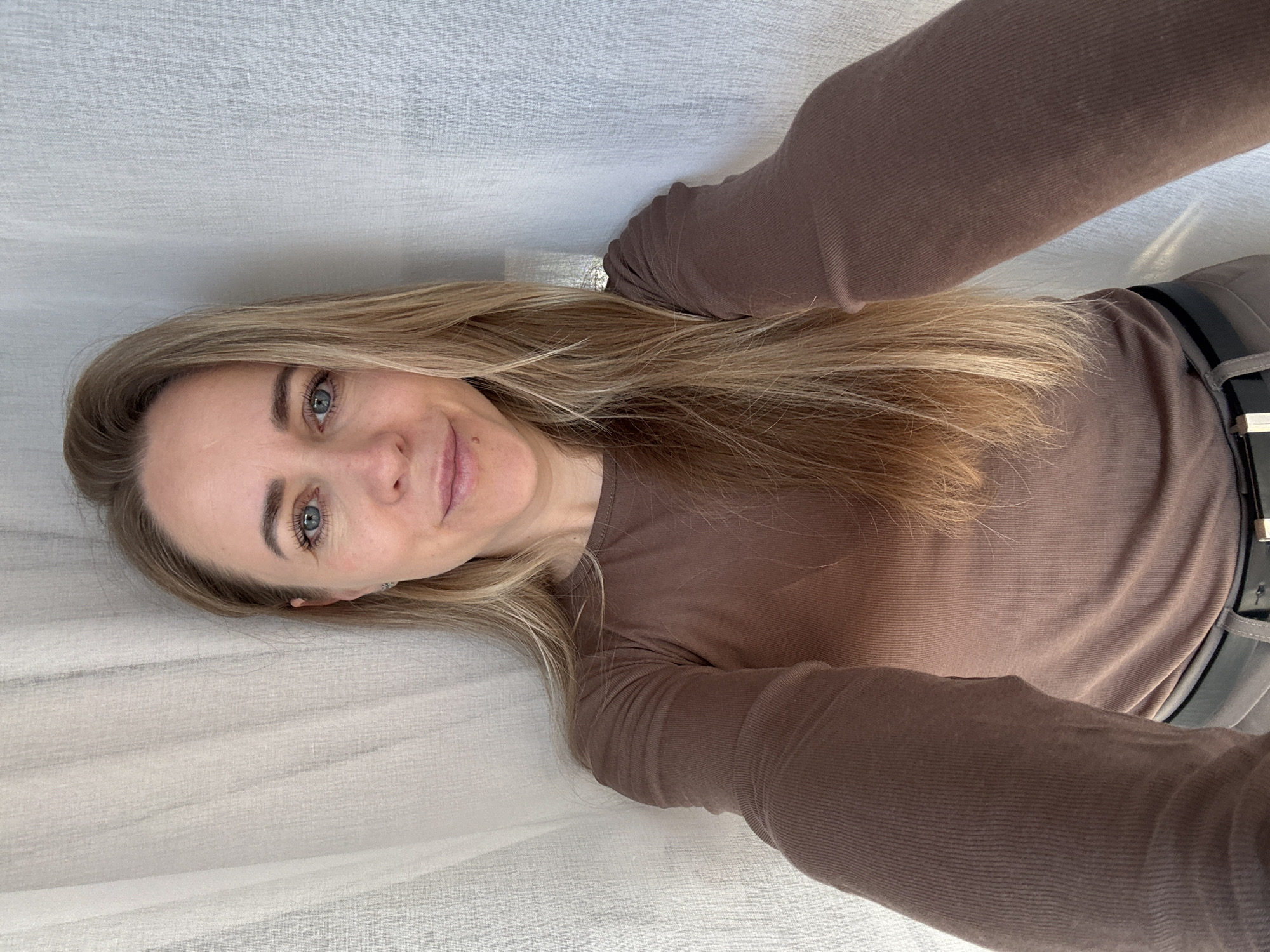 Woman takes selfies indoors in Chaikovsky, Russia