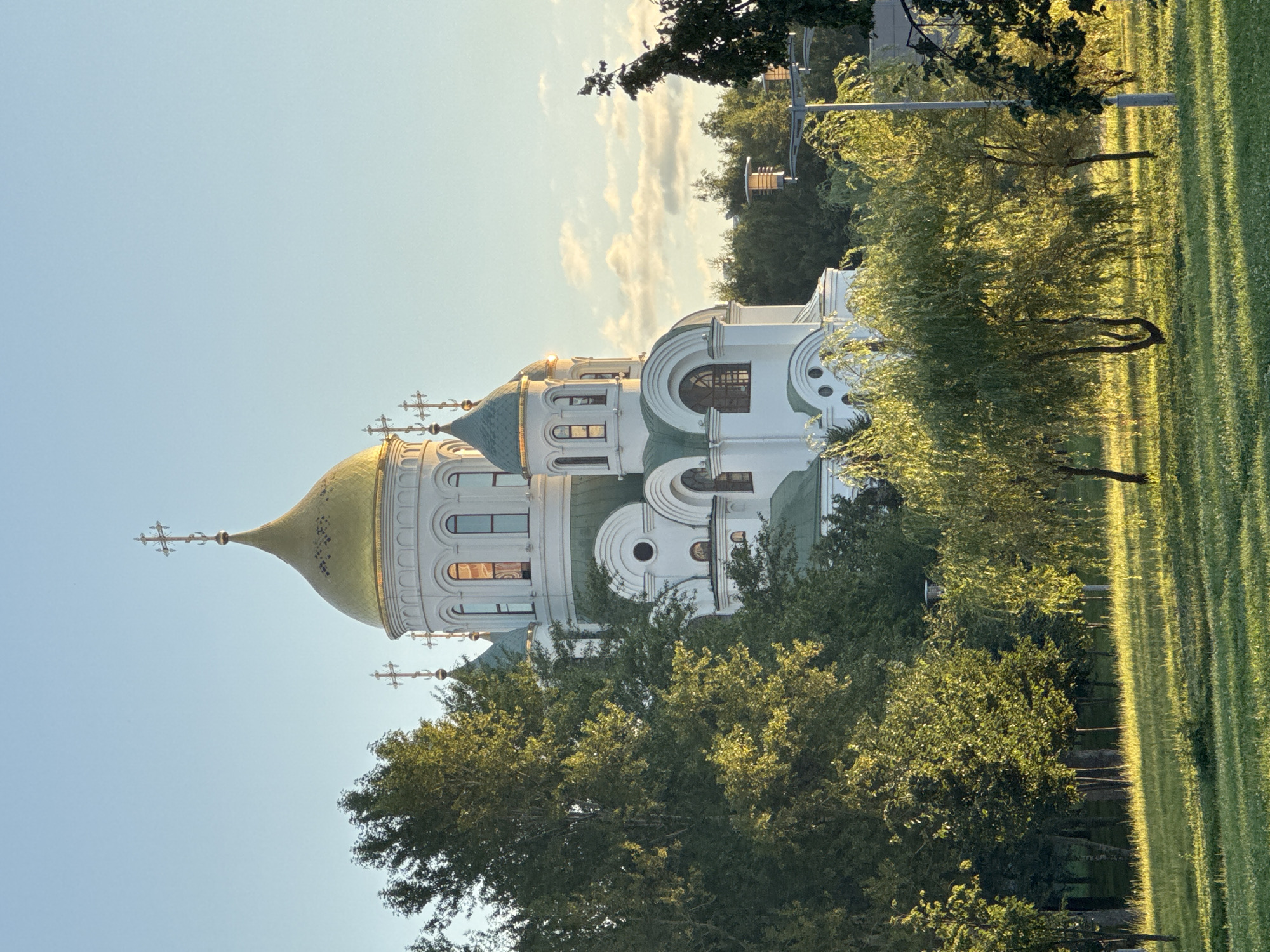 Golden hour across Moscow streets and Patriot Park church