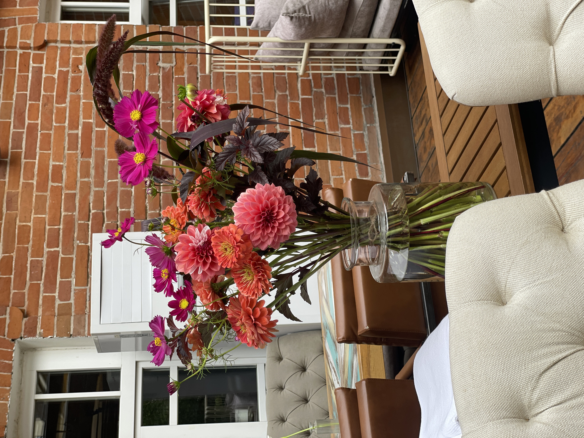 Warm-toned floral arrangements at two Novosibirsk spots