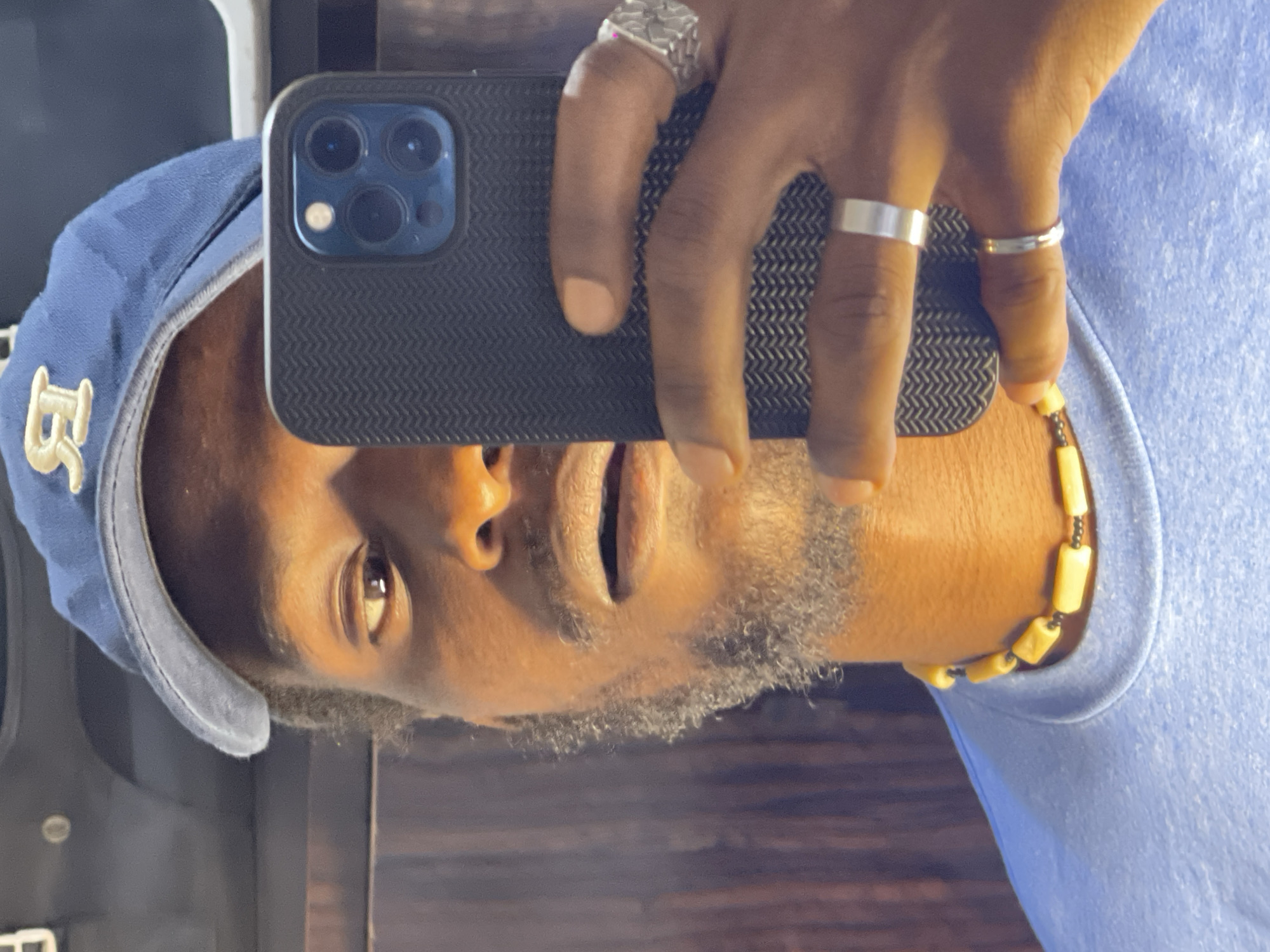 Quick selfie session in Abuja, blue cap and beads