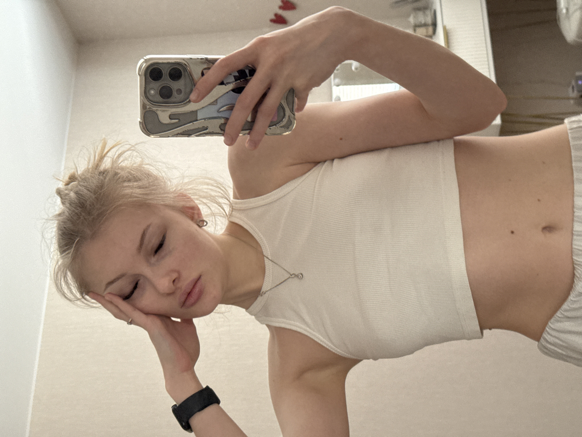 Woman takes multiple selfies in Perm apartment settings