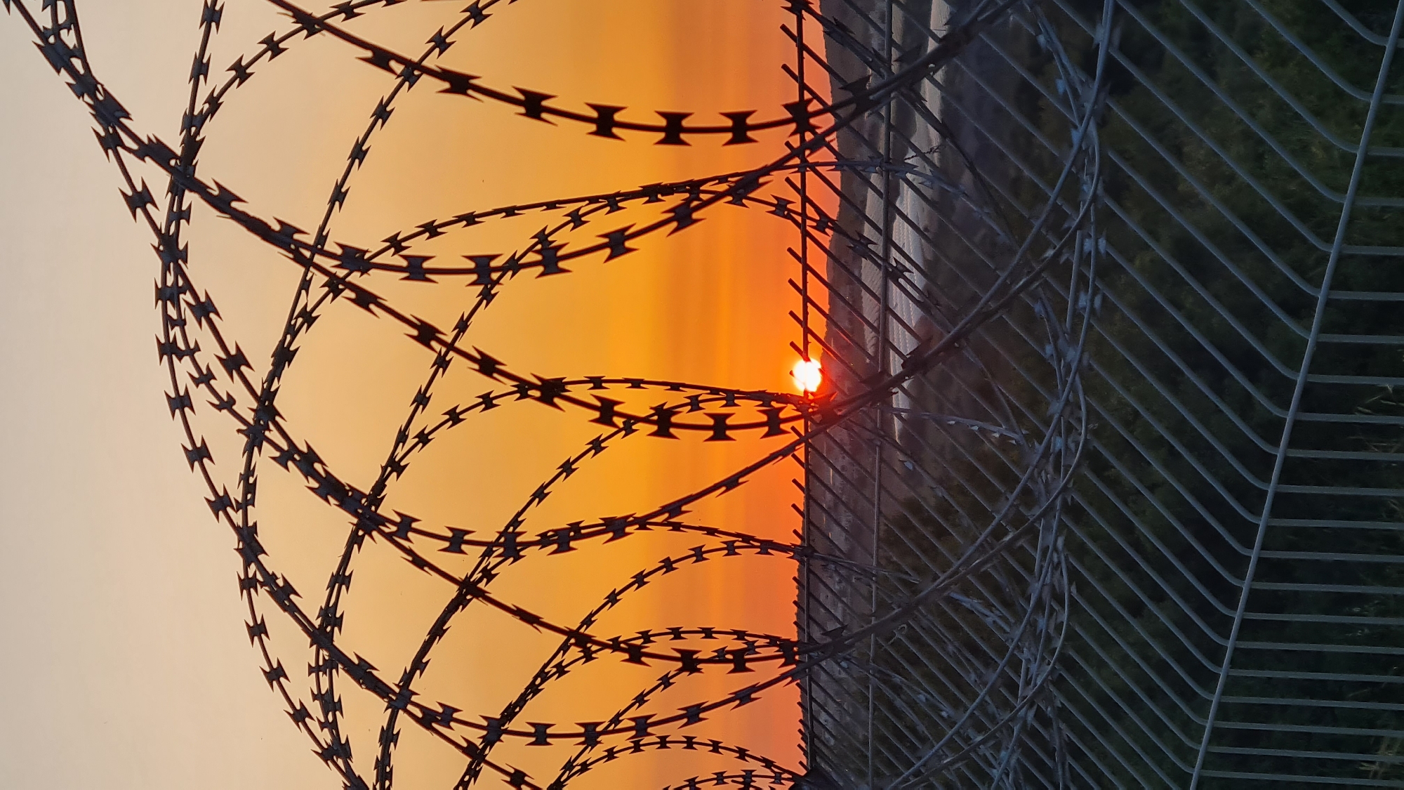 Sunset documented through barbed wire in Lachish Regional Council