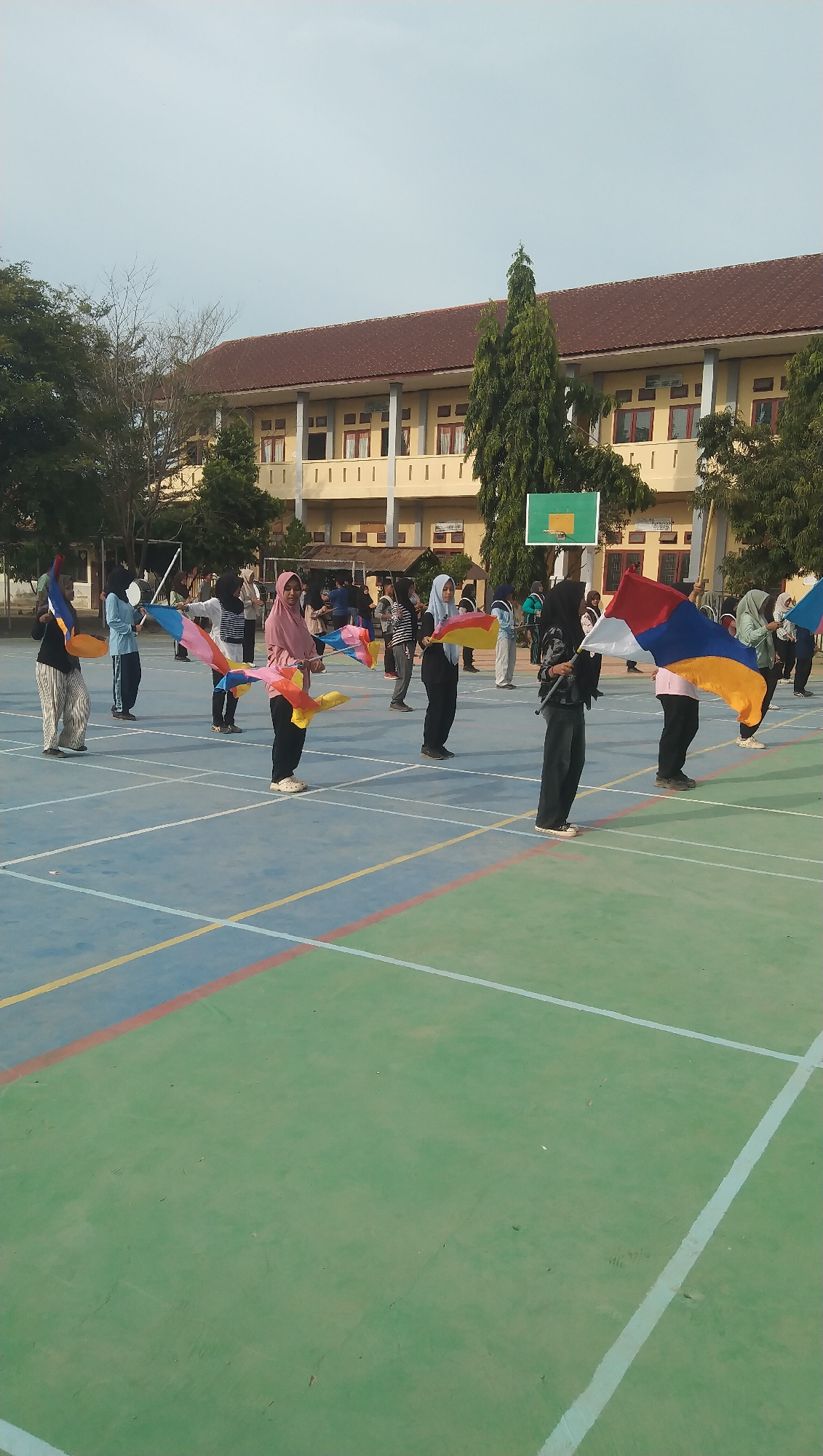 Marching band practice and a kids' carnival ride in Aceh
