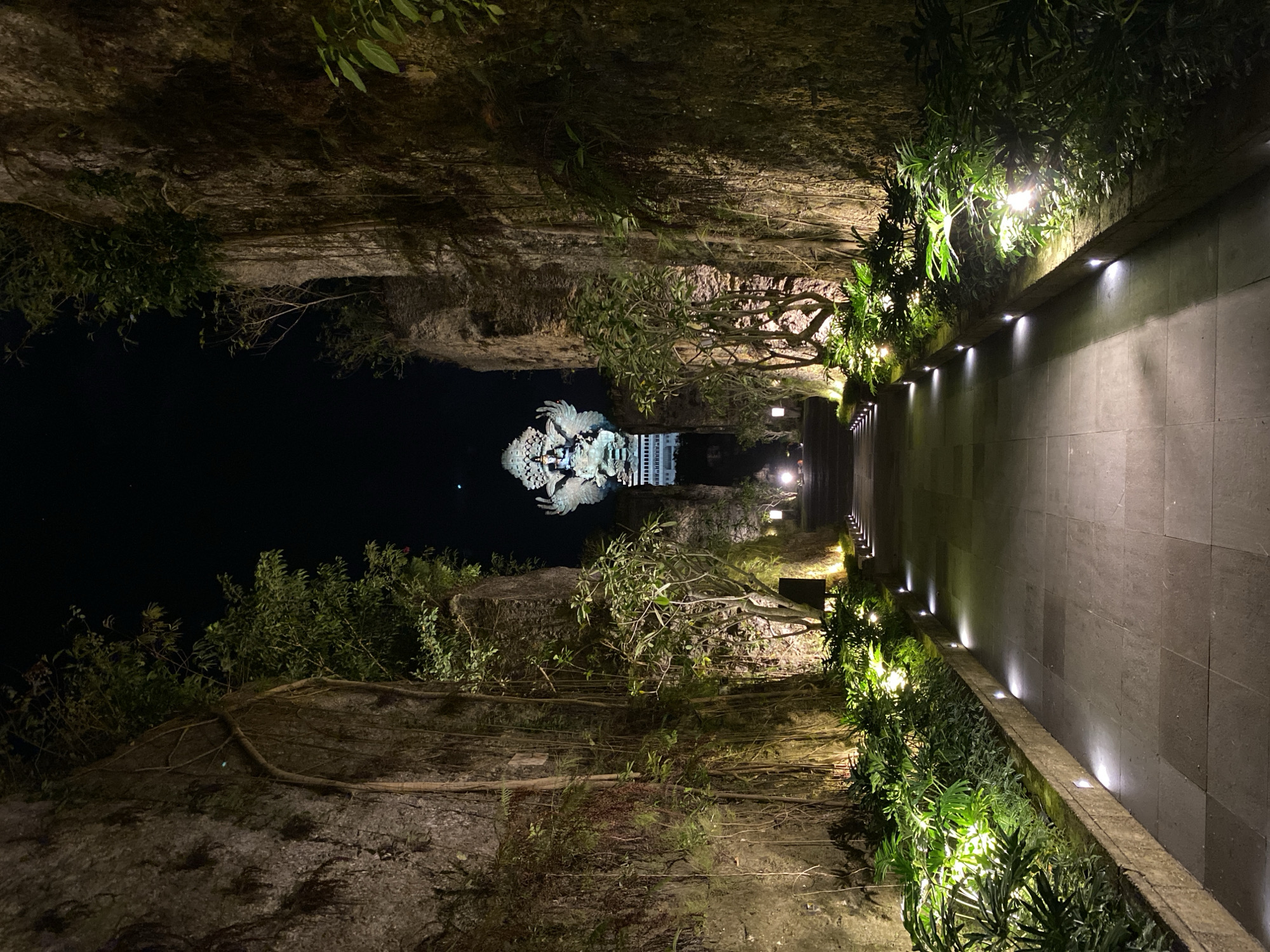Nighttime tour through illuminated Hindu-Balinese sculpture garden