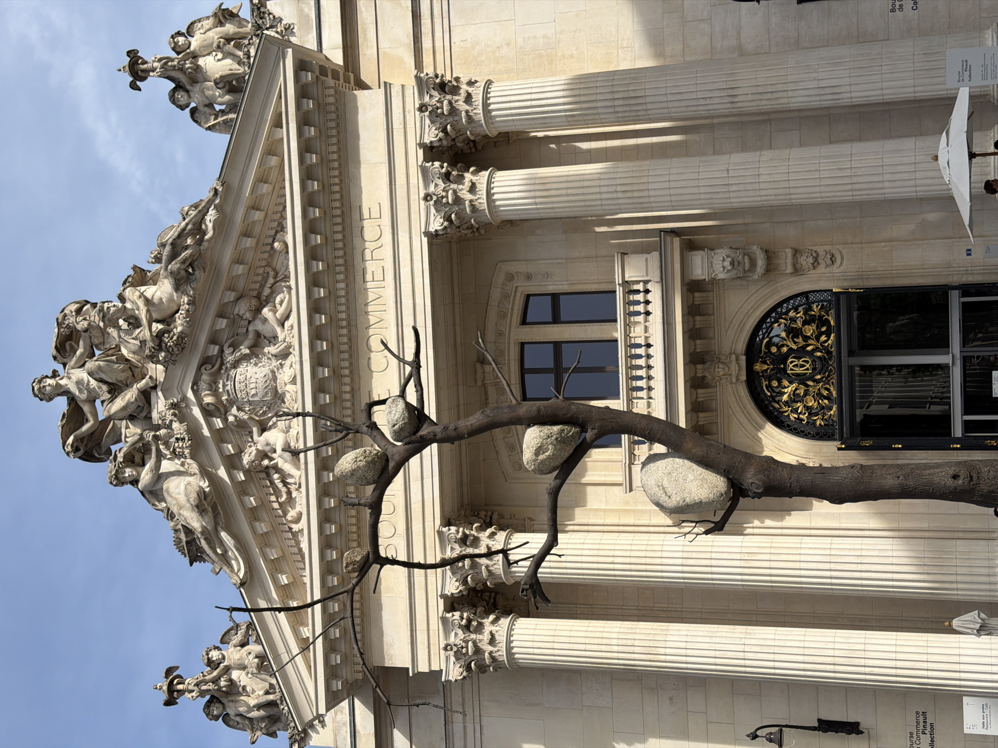 Reflective architecture and metallic flag observed in central Paris