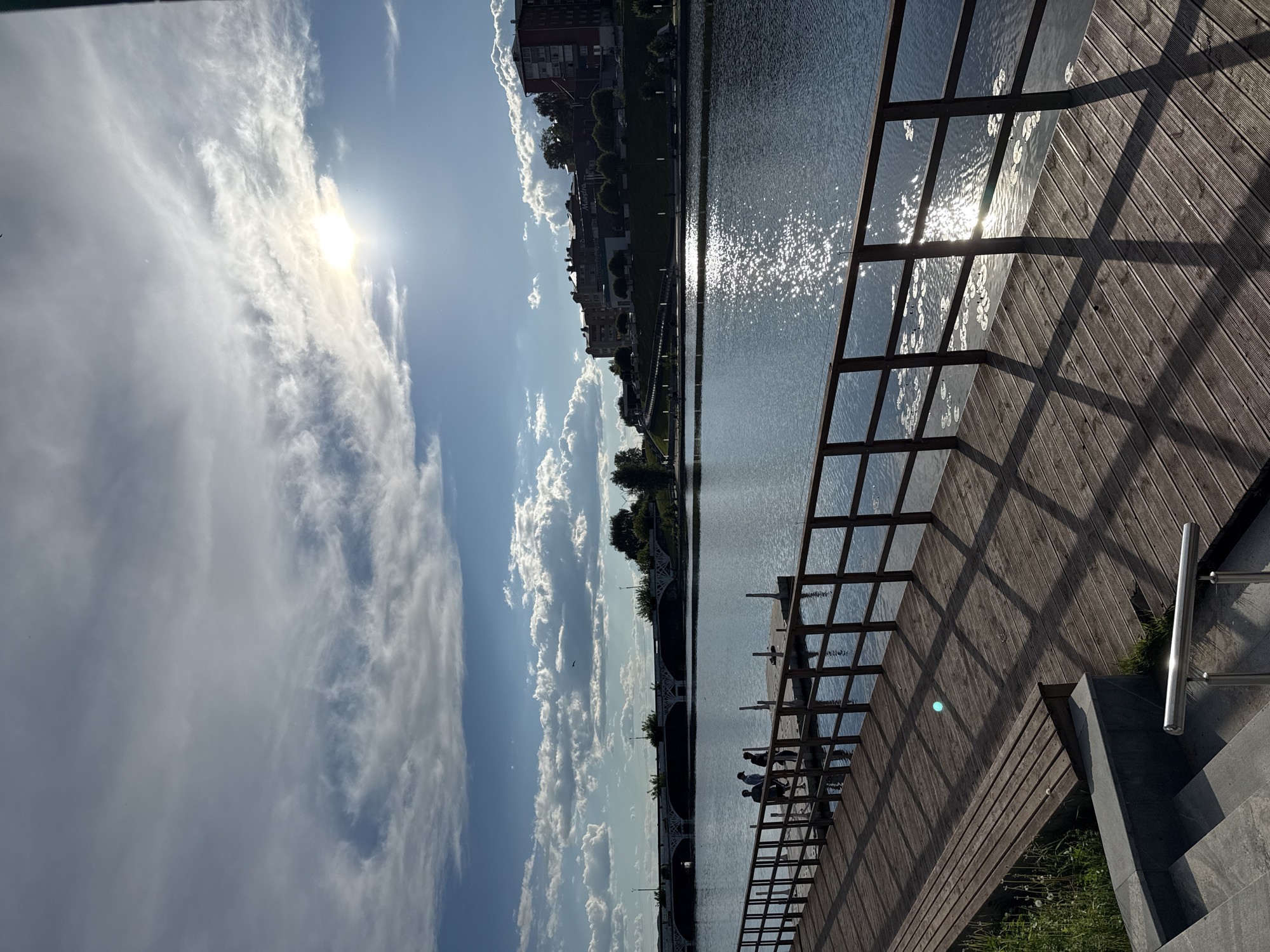 Families enjoy sunny afternoon along Votkinsk waterfront boardwalk