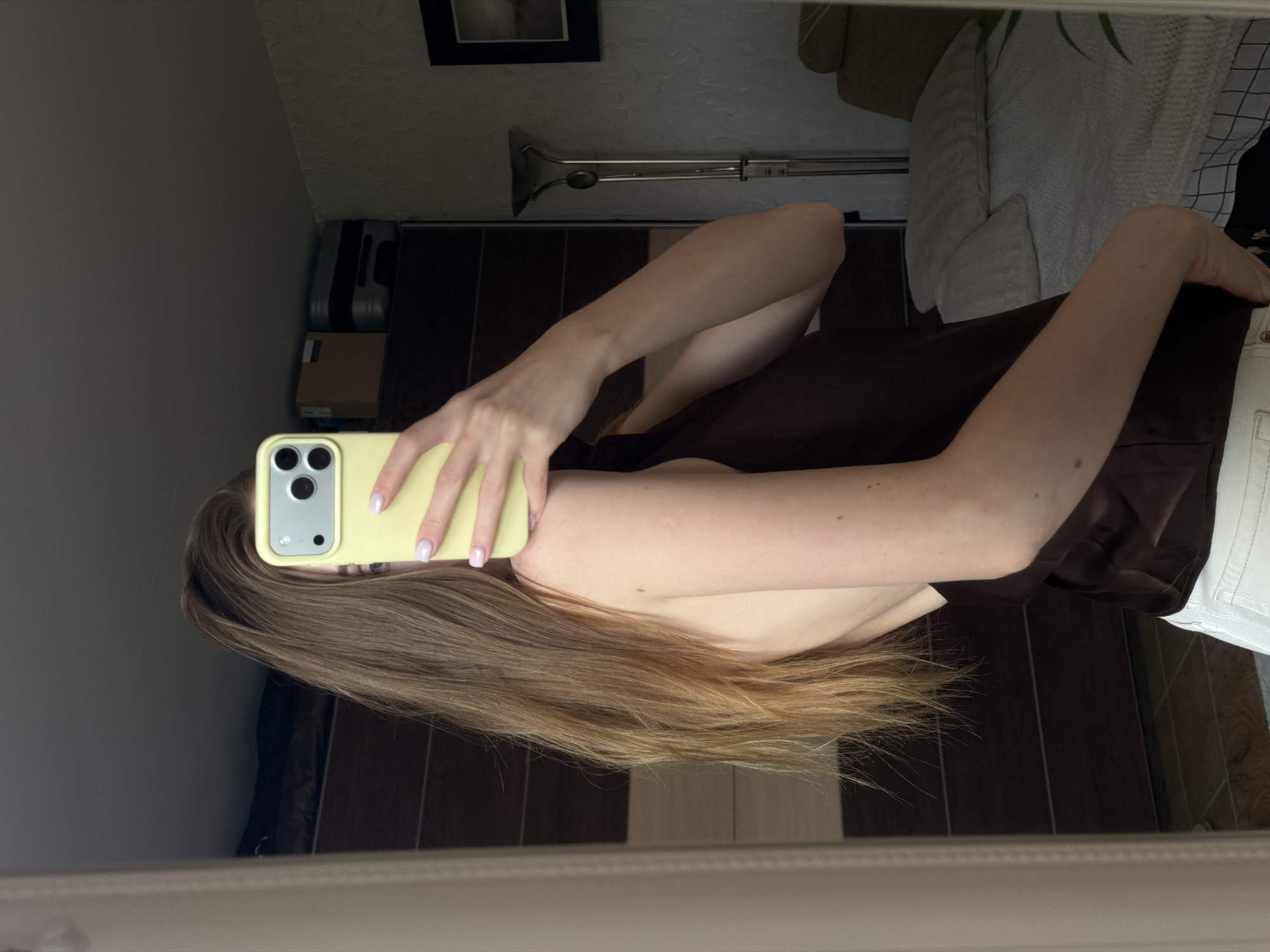 Woman Takes Multiple Mirror Selfies in Gorzow Bedroom