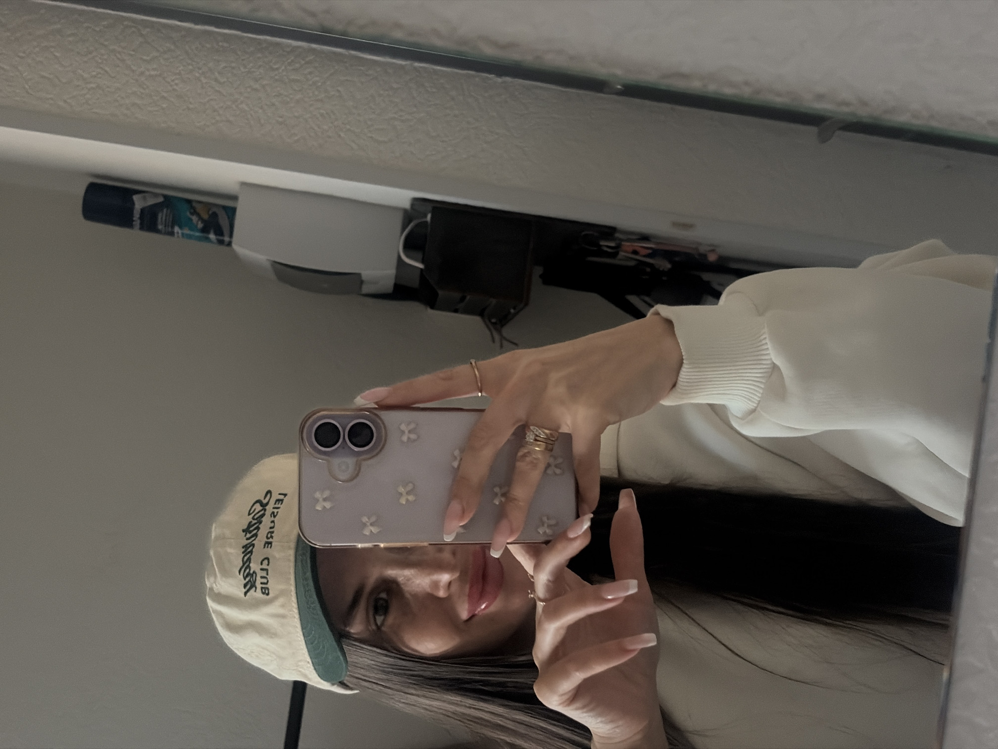 Woman Takes Multiple Mirror Selfies in Saint Petersburg