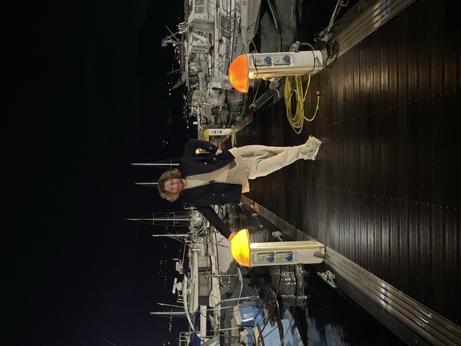 Late-night street musician performs acoustic set near Budva marina