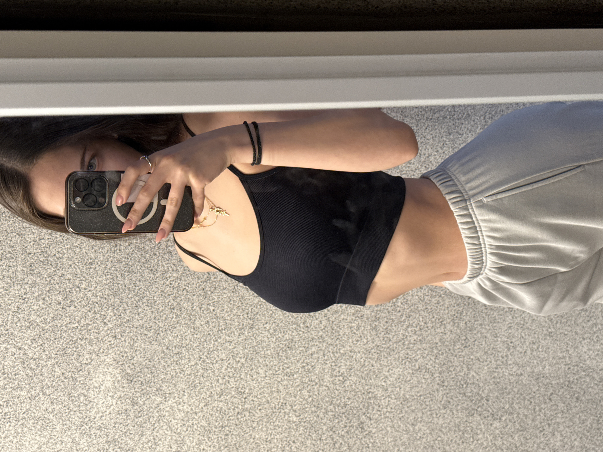 Woman takes mirror selfies indoors in Sofia, Bulgaria