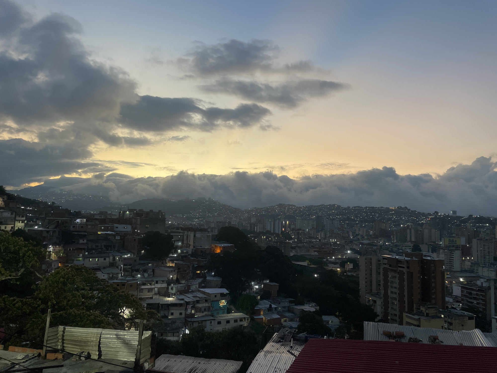 Aerial views capture Caracas cityscape at dusk