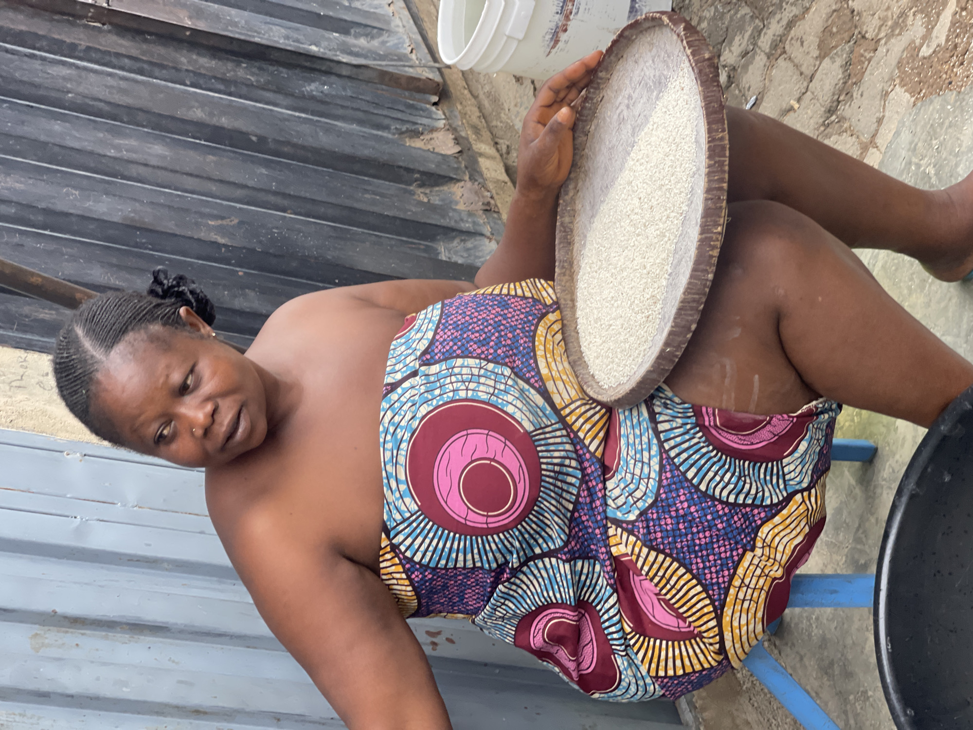 Women and children perform daily household tasks in Nyanya