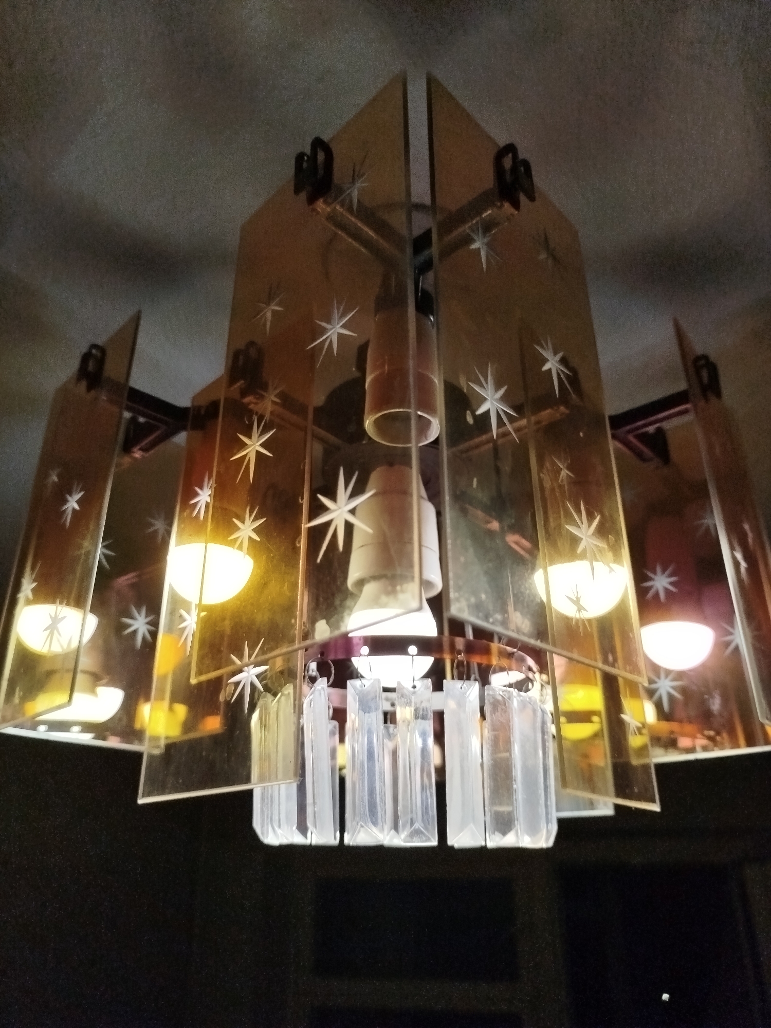 Close-up shots of four decorative ceiling light fixtures