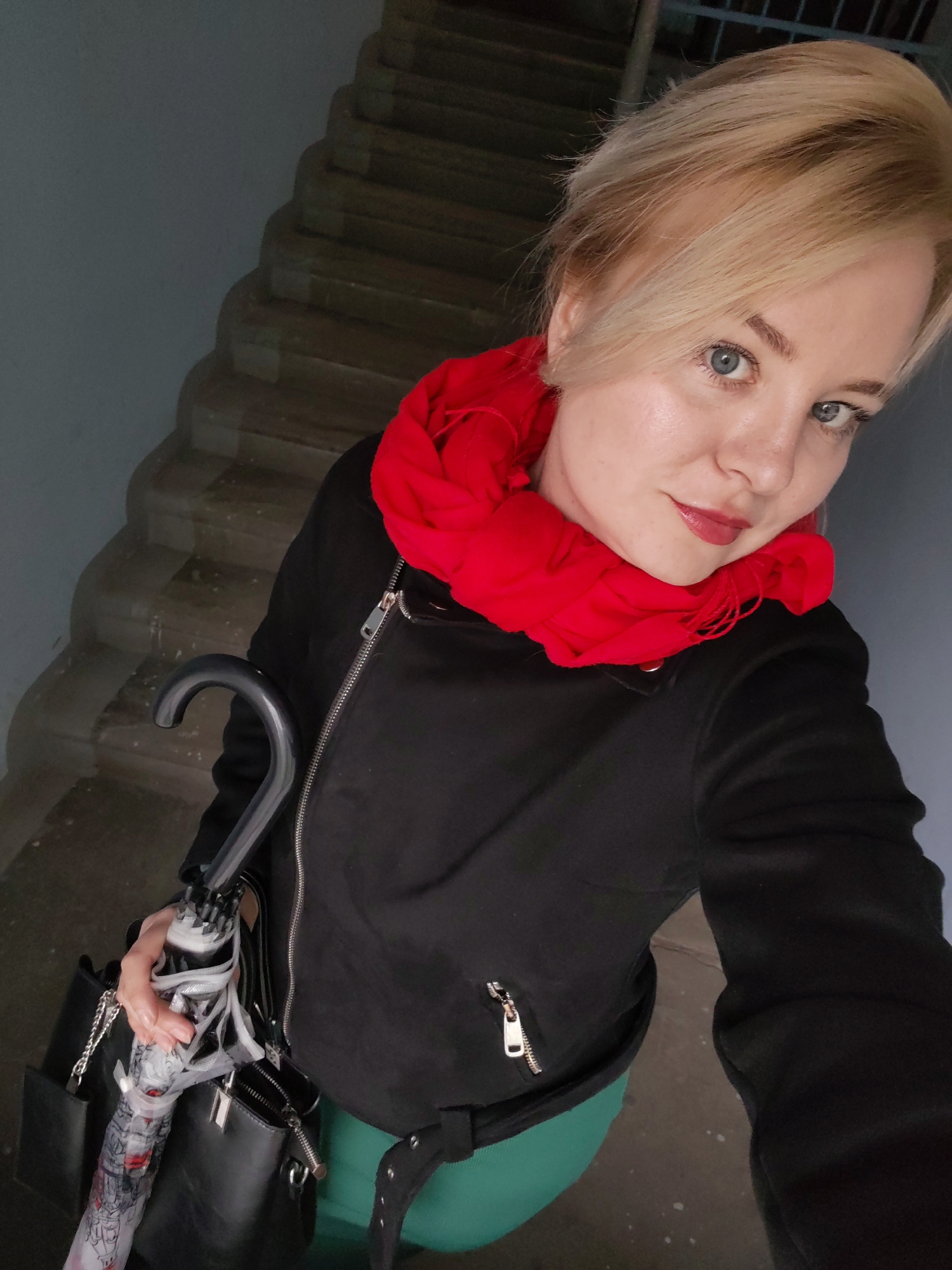 Woman greets morning on staircase in Izhevsk, Russia