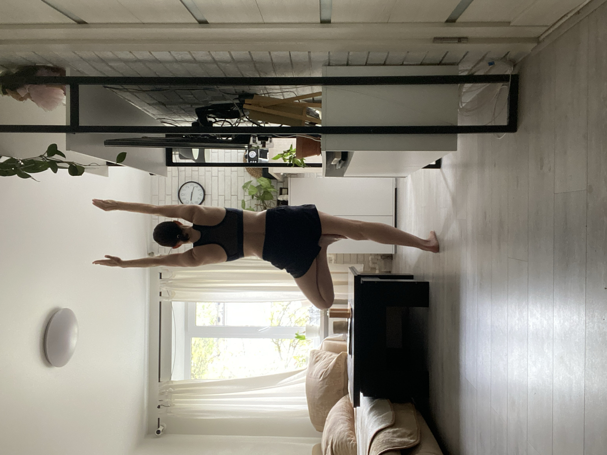 Woman practices early morning yoga in Chaikovsky, Russia