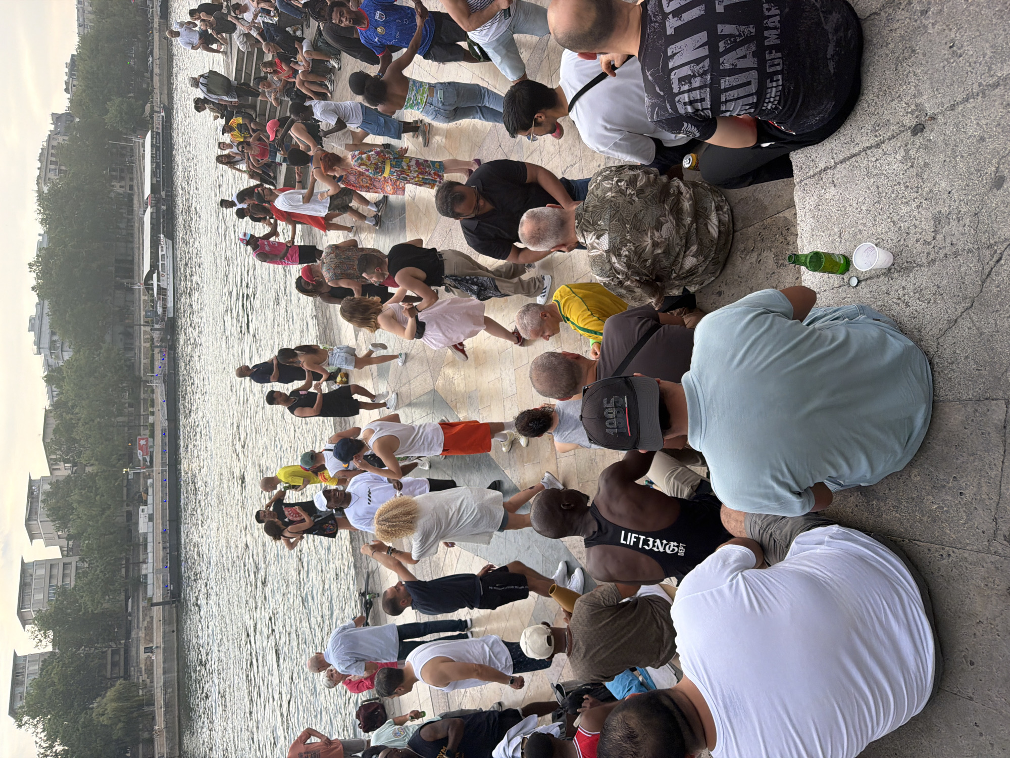 Dancing and socializing along the Seine on a summer evening