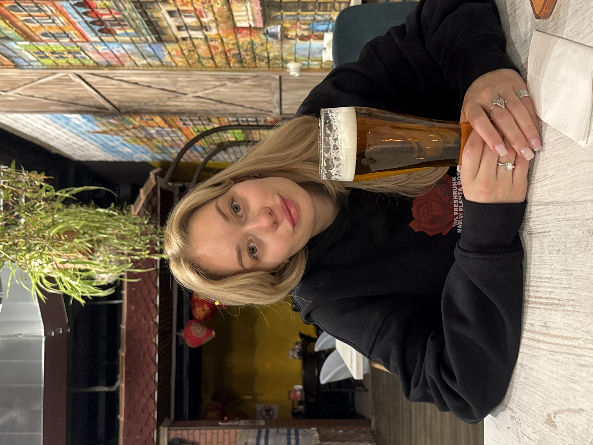 Woman dining at Moscow cafe captured in evening photos