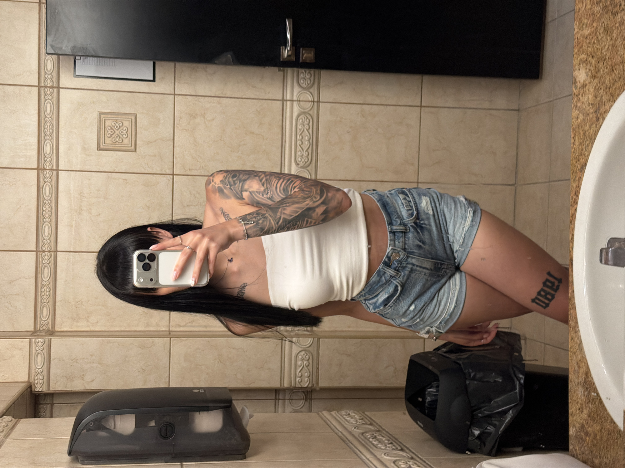 Woman takes mirror selfies in Plovdiv restroom