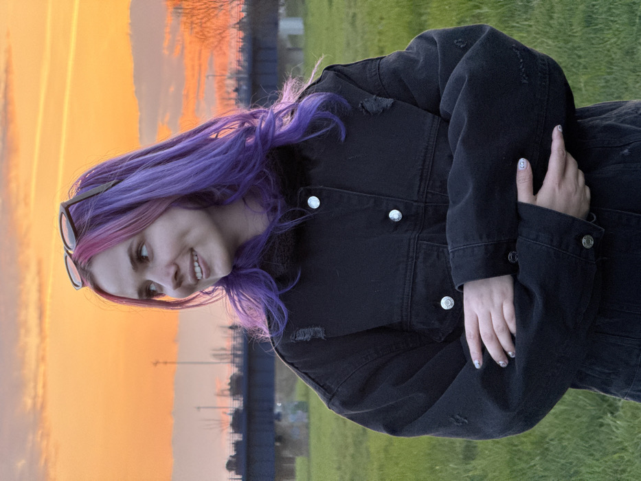 Woman photographs sunset portrait session by Zagreb's Sava River