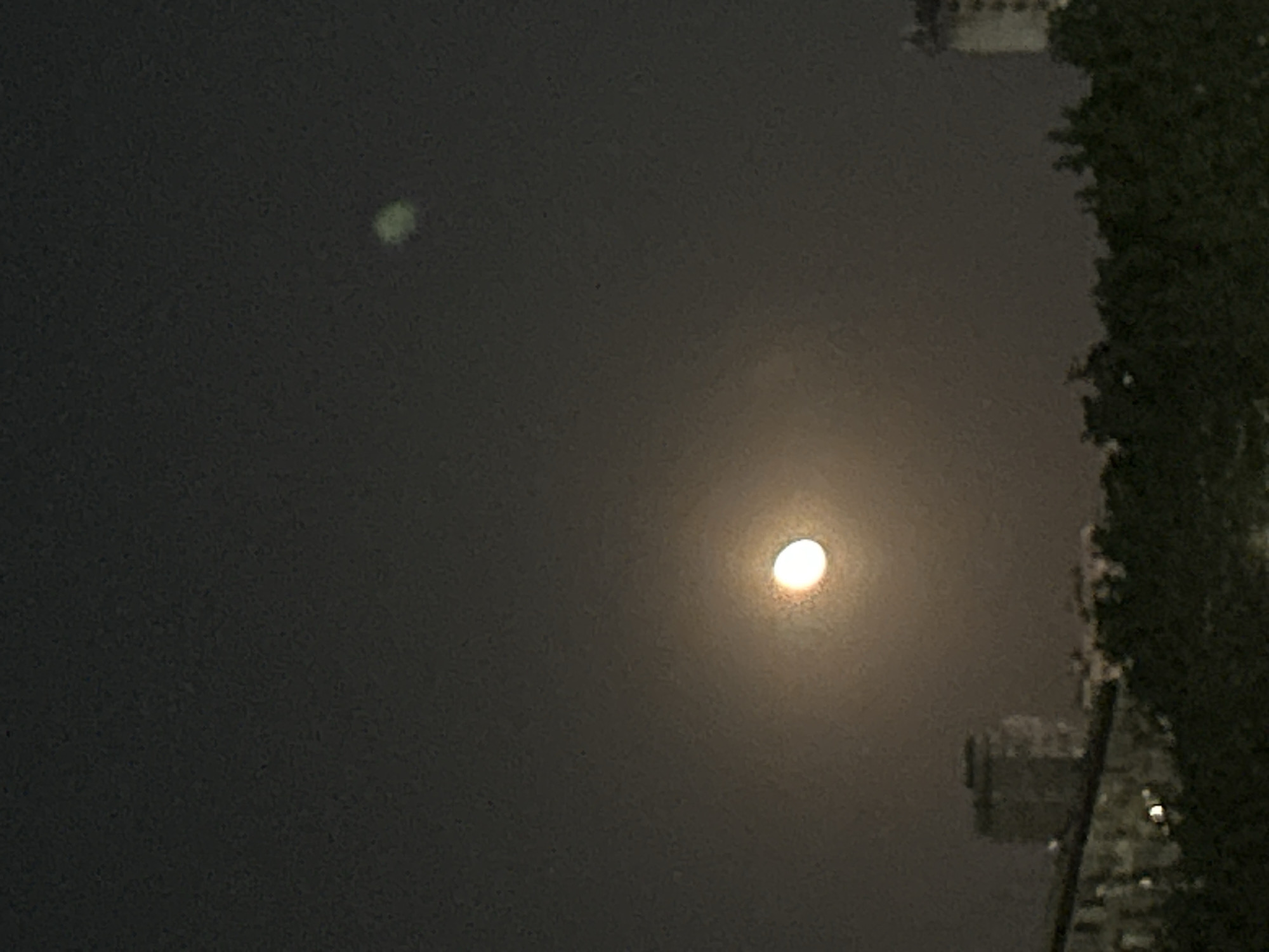 Unusual green glow observed alongside moon in Burgas night sky
