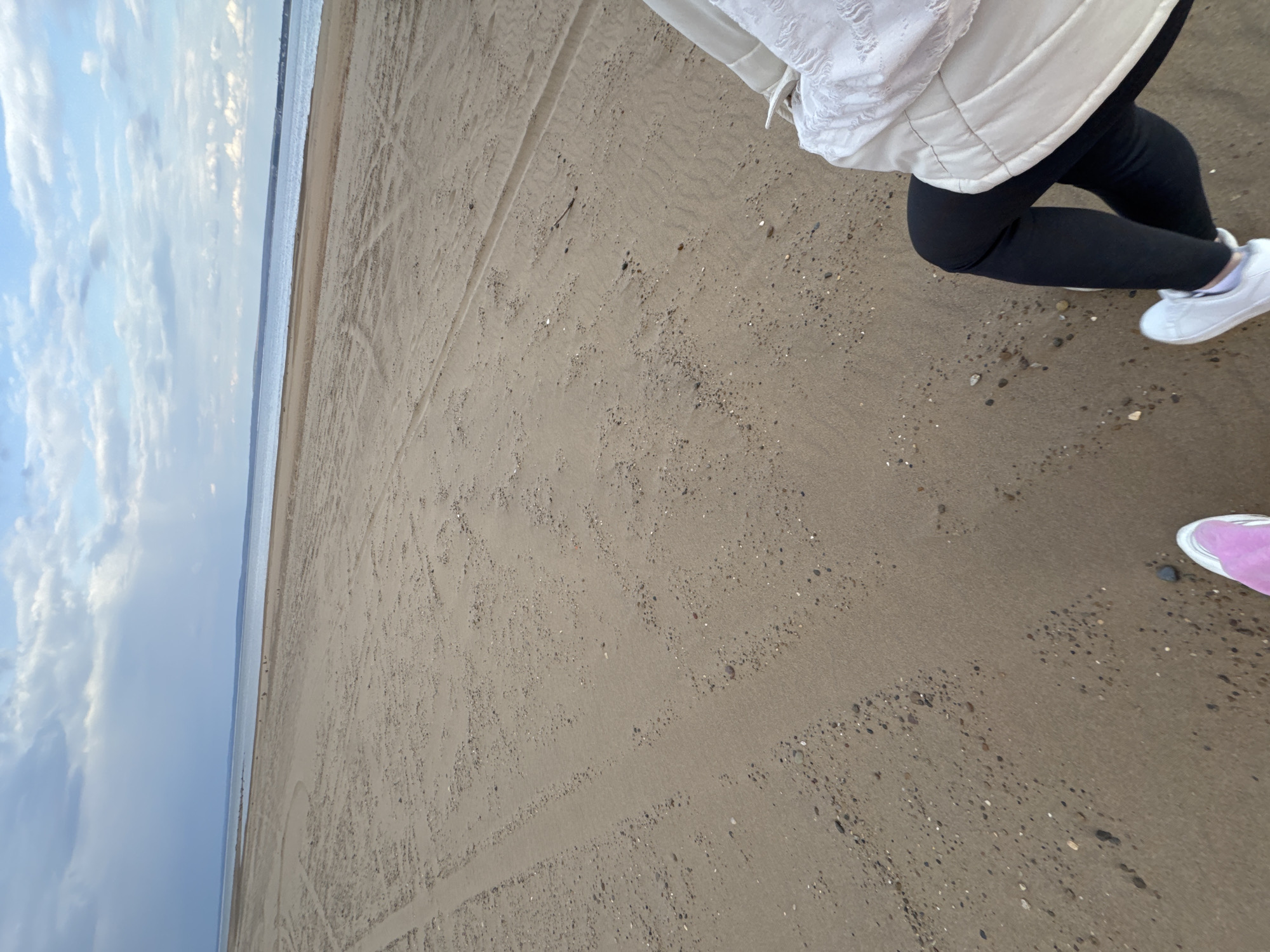 Two people spotted on overcast beach in Chaikovsky, Russia