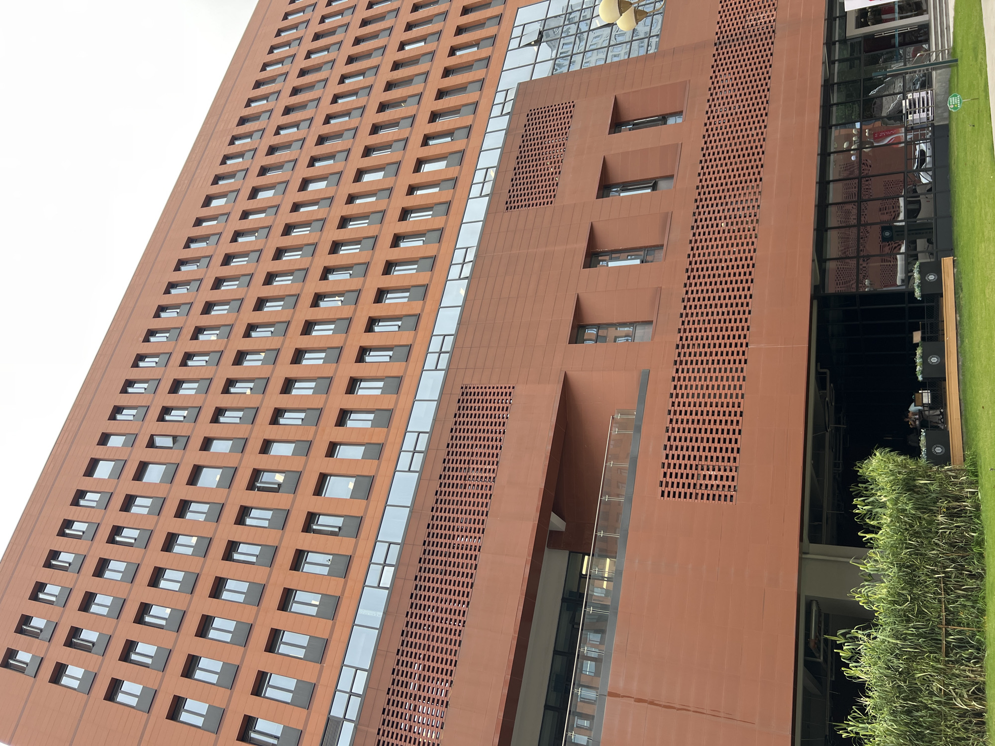 Plaza statue and pedestrian activity documented in Yuzhong District