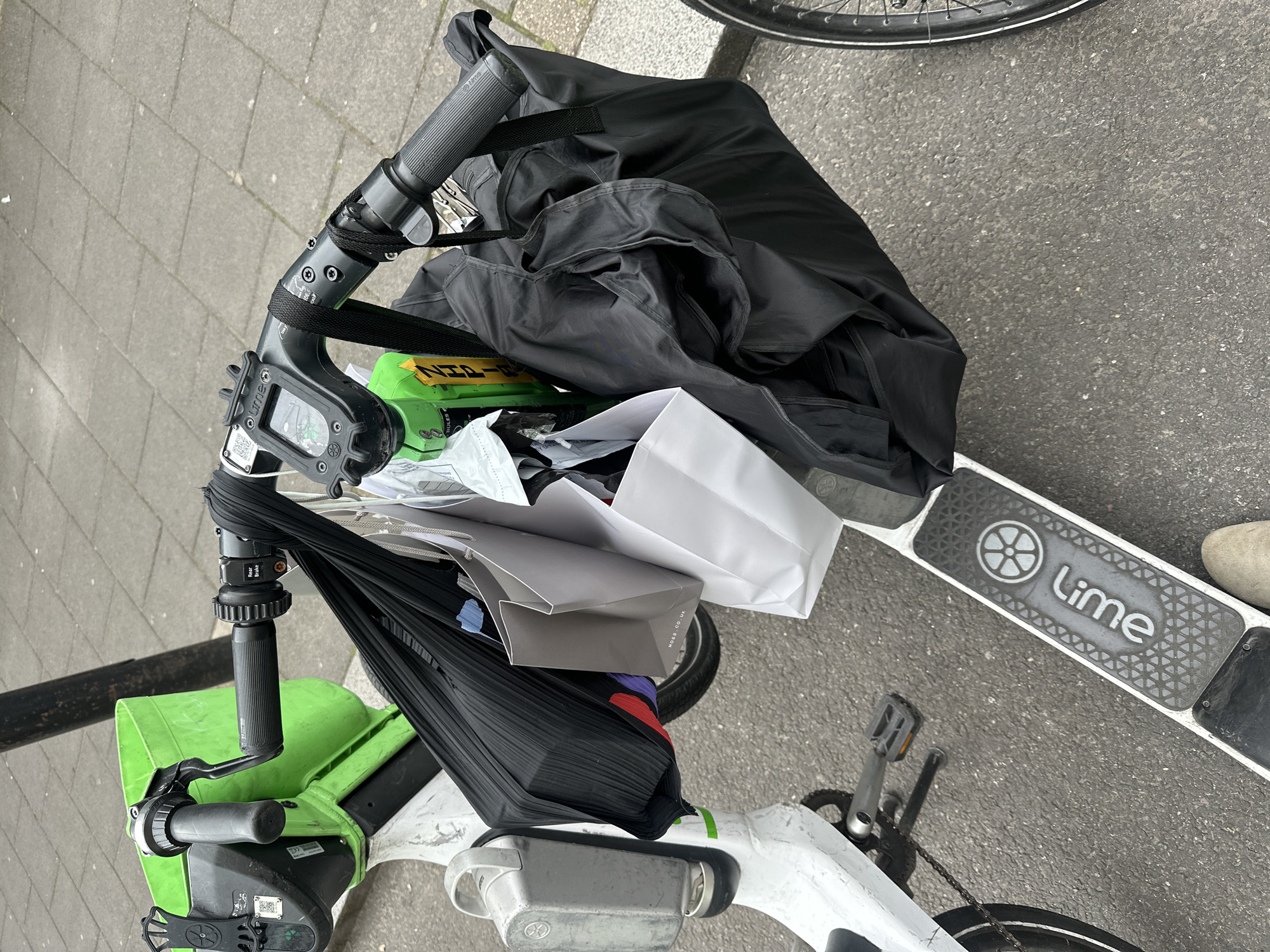 Shopping-laden Lime bike parked on London street