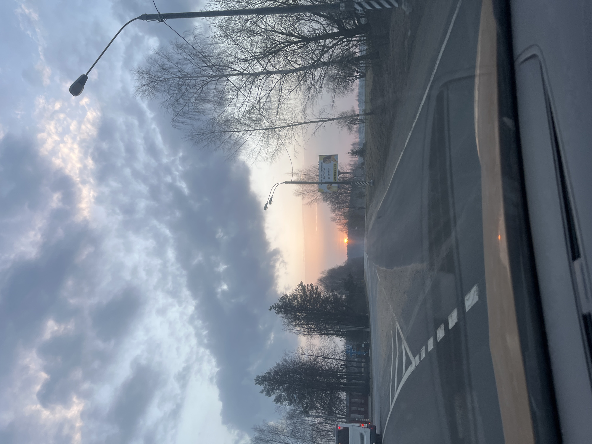 Sunset viewed from vehicle on Russian road