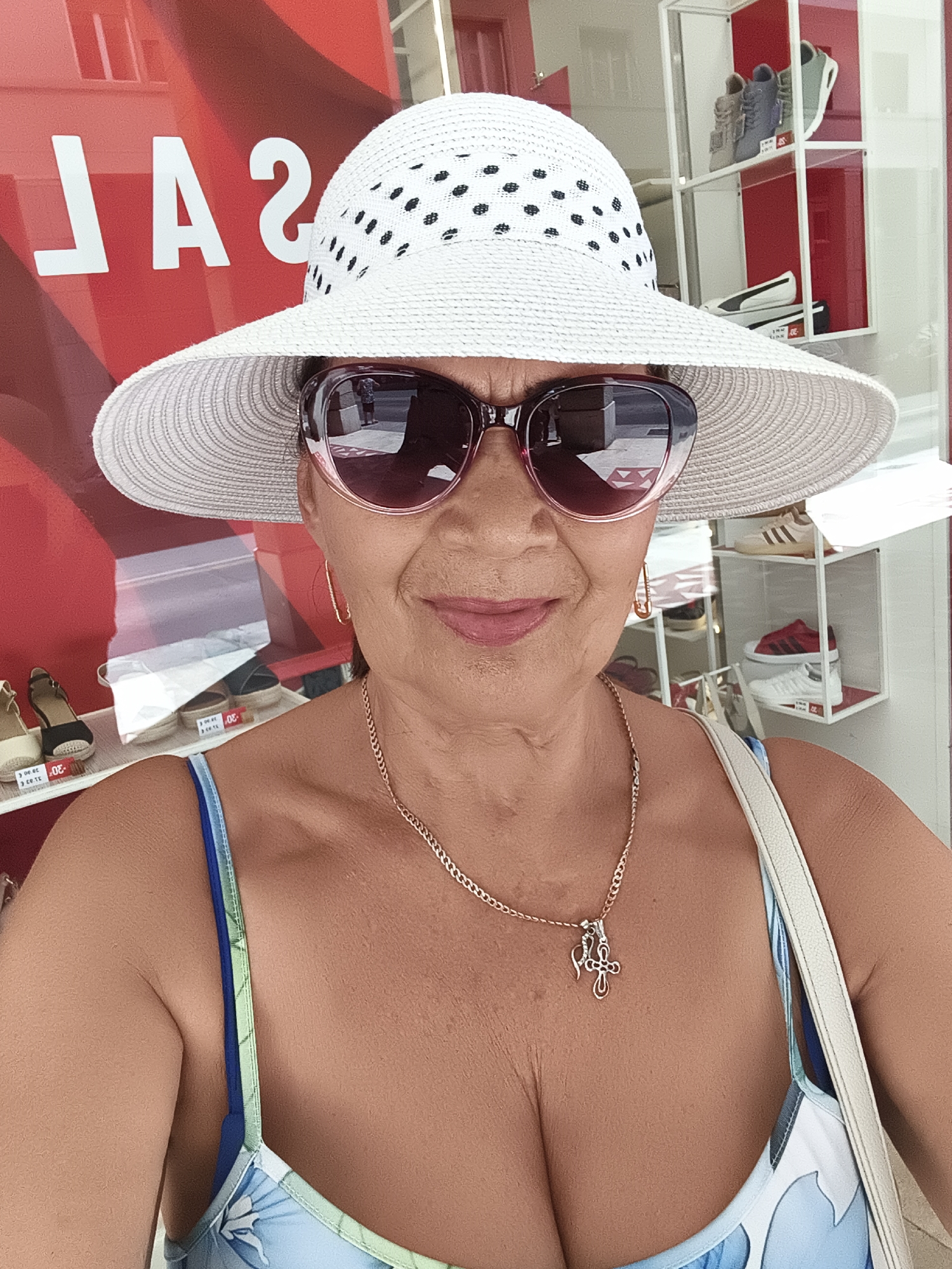 Polka dot hat and summer dress in Livorno