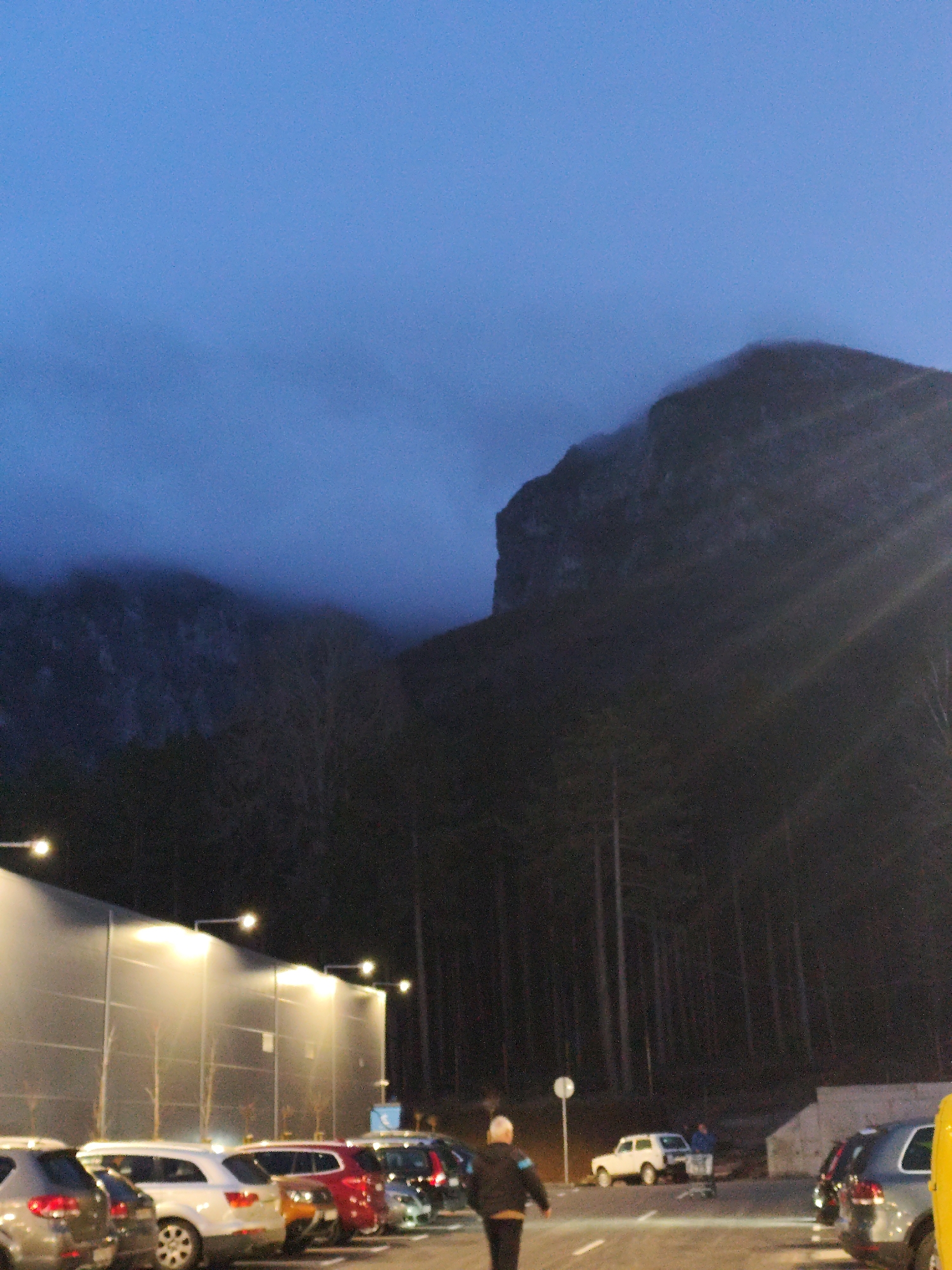 Evening parking lot scenes captured near industrial building in Vratsa
