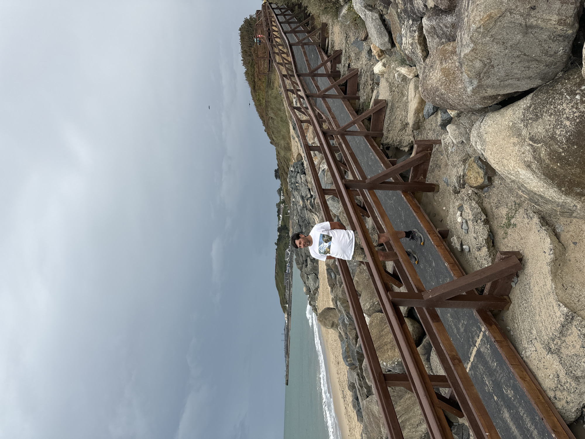 Overcast afternoon on Courtown's boardwalk and rocky shore