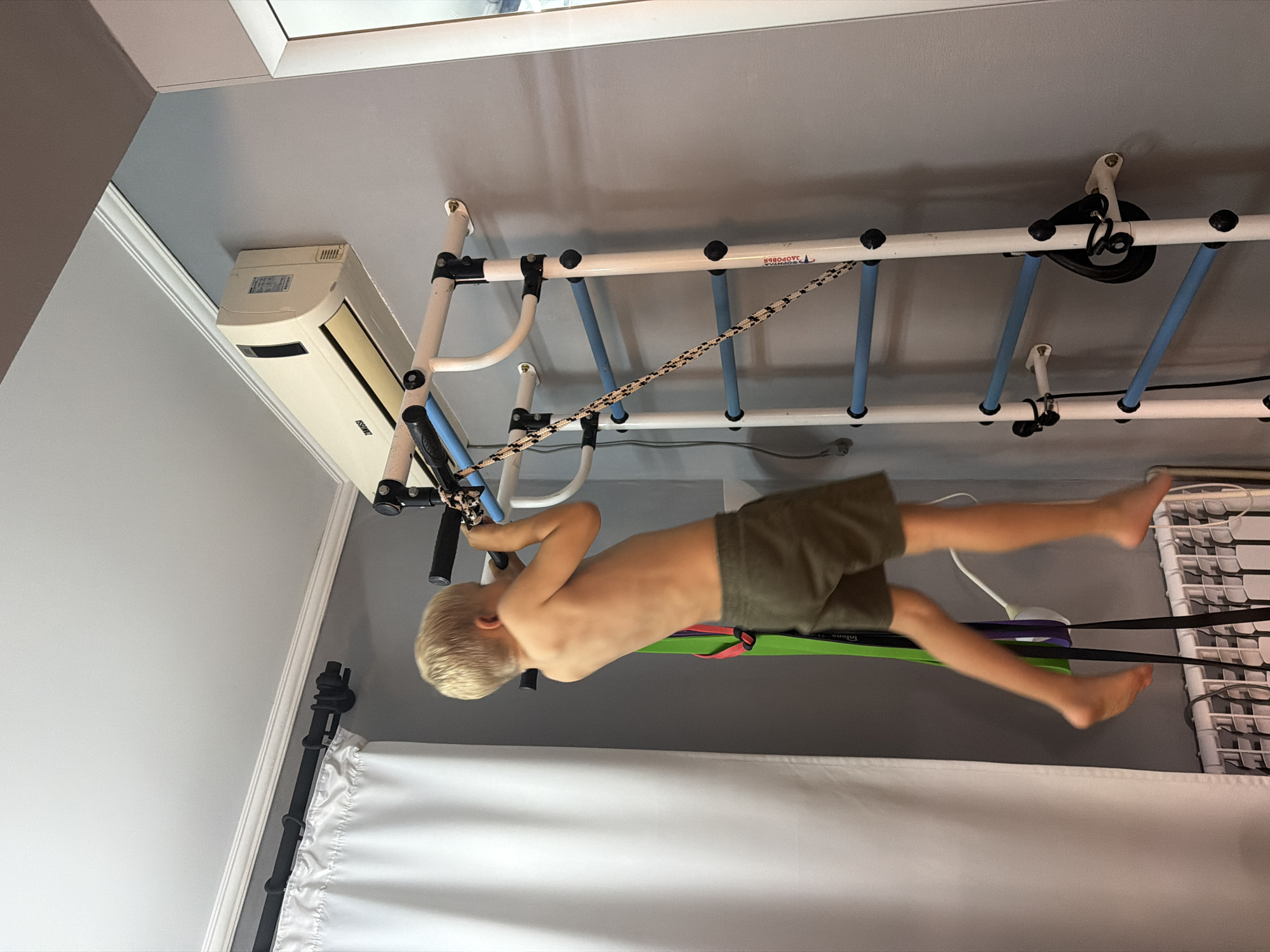 Family documents children's playtime and waffle-making in Sochi apartment
