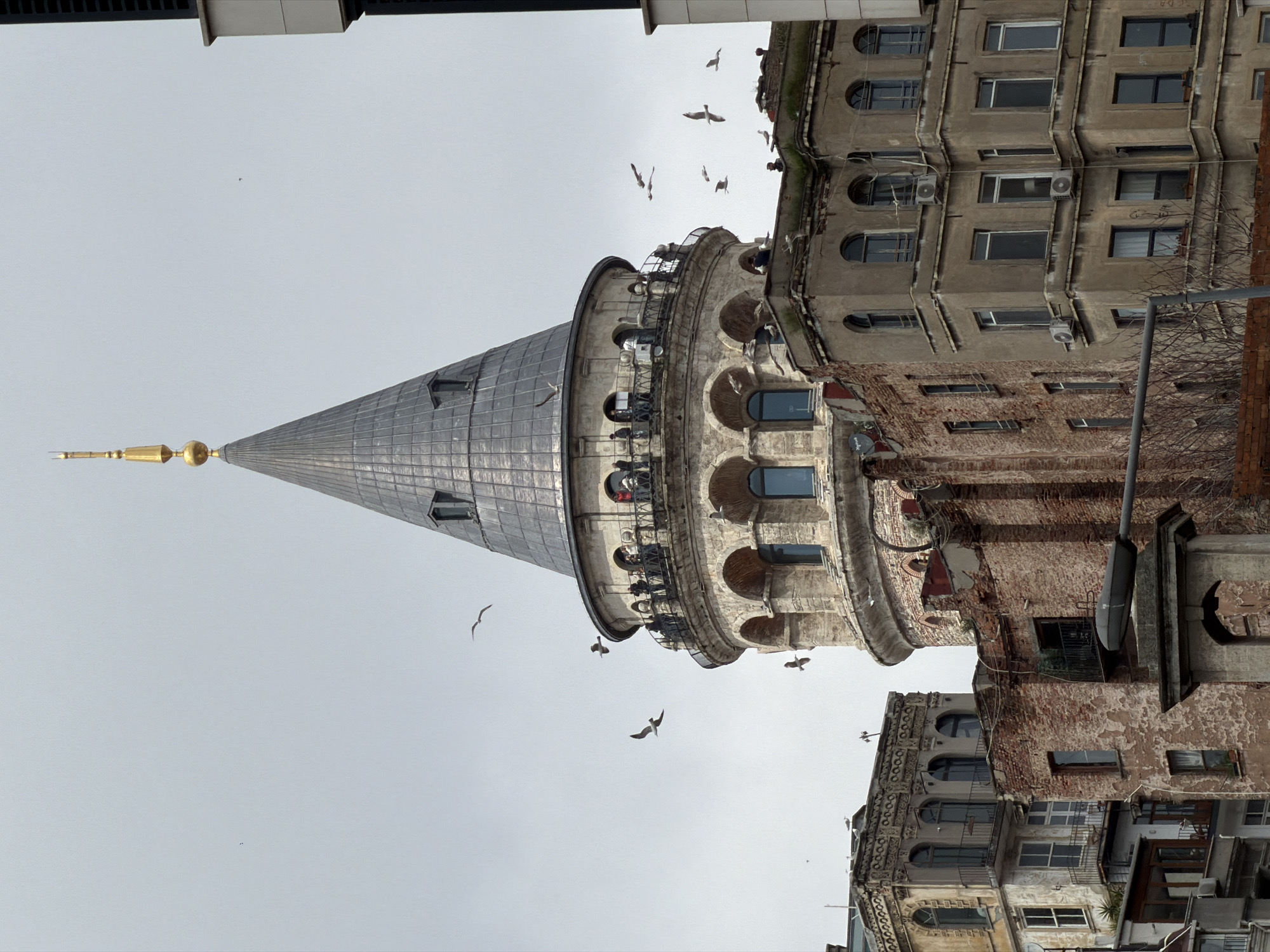 Galata Tower photographed under overcast skies in Istanbul