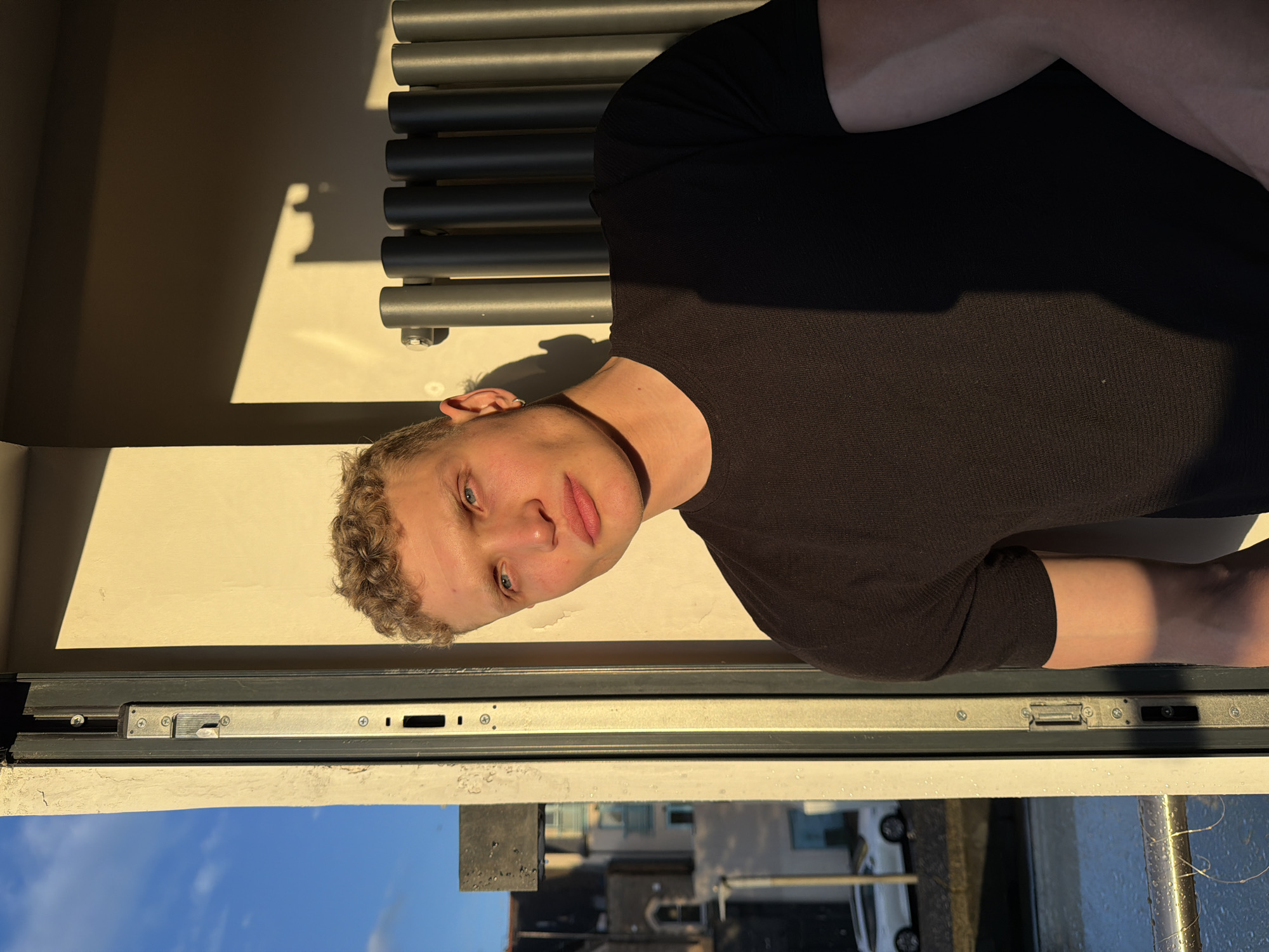 Person observed near window in London, appears nervous