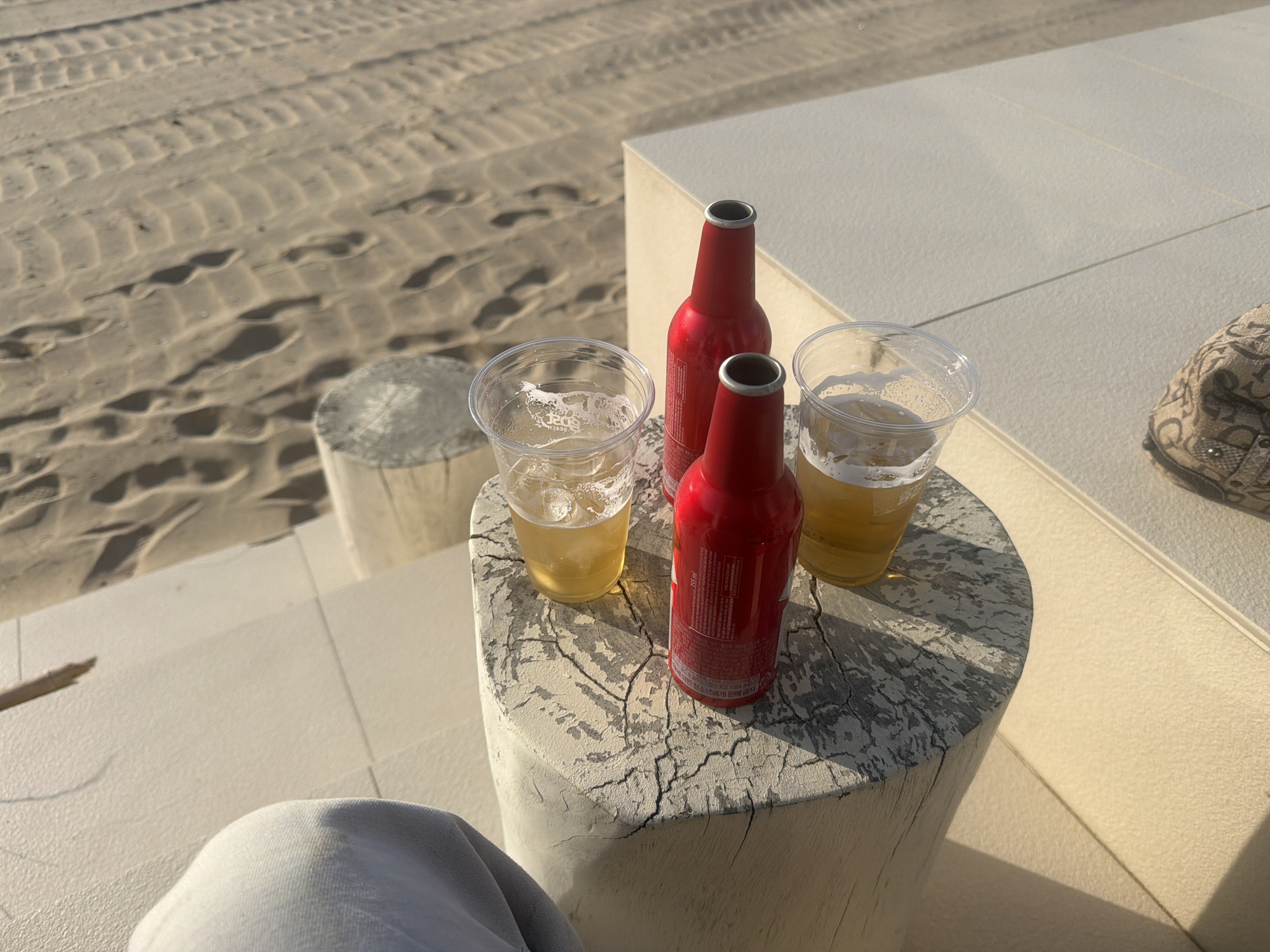Morning beach gathering with drinks documented in Hyeonbuk