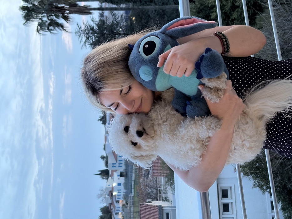 Woman spends afternoon with dog on Budva balcony